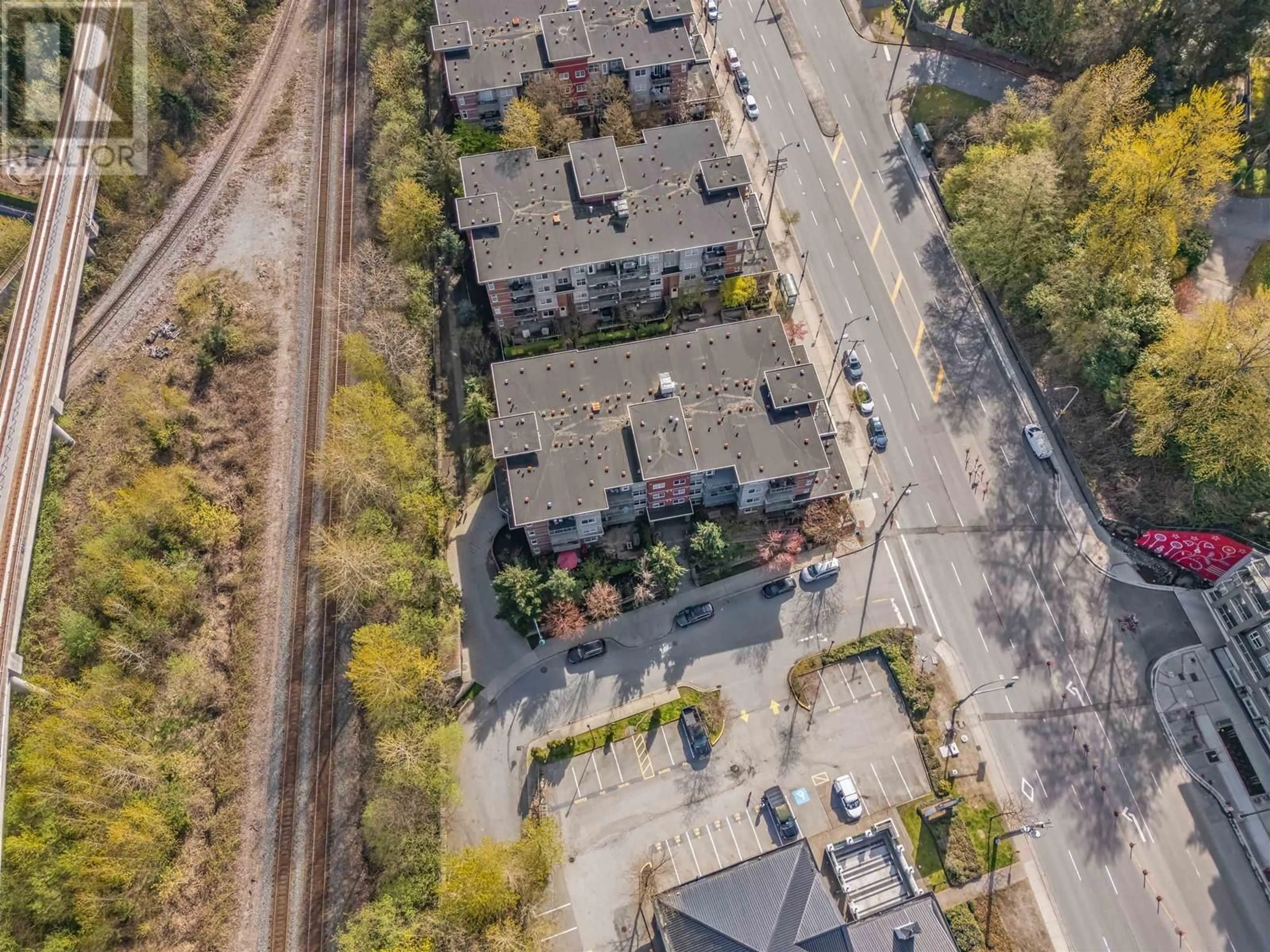 A pic from outside/outdoor area/front of a property/back of a property/a pic from drone, street for 203 - 3240 ST JOHNS STREET, Port Moody British Columbia V3H0C1