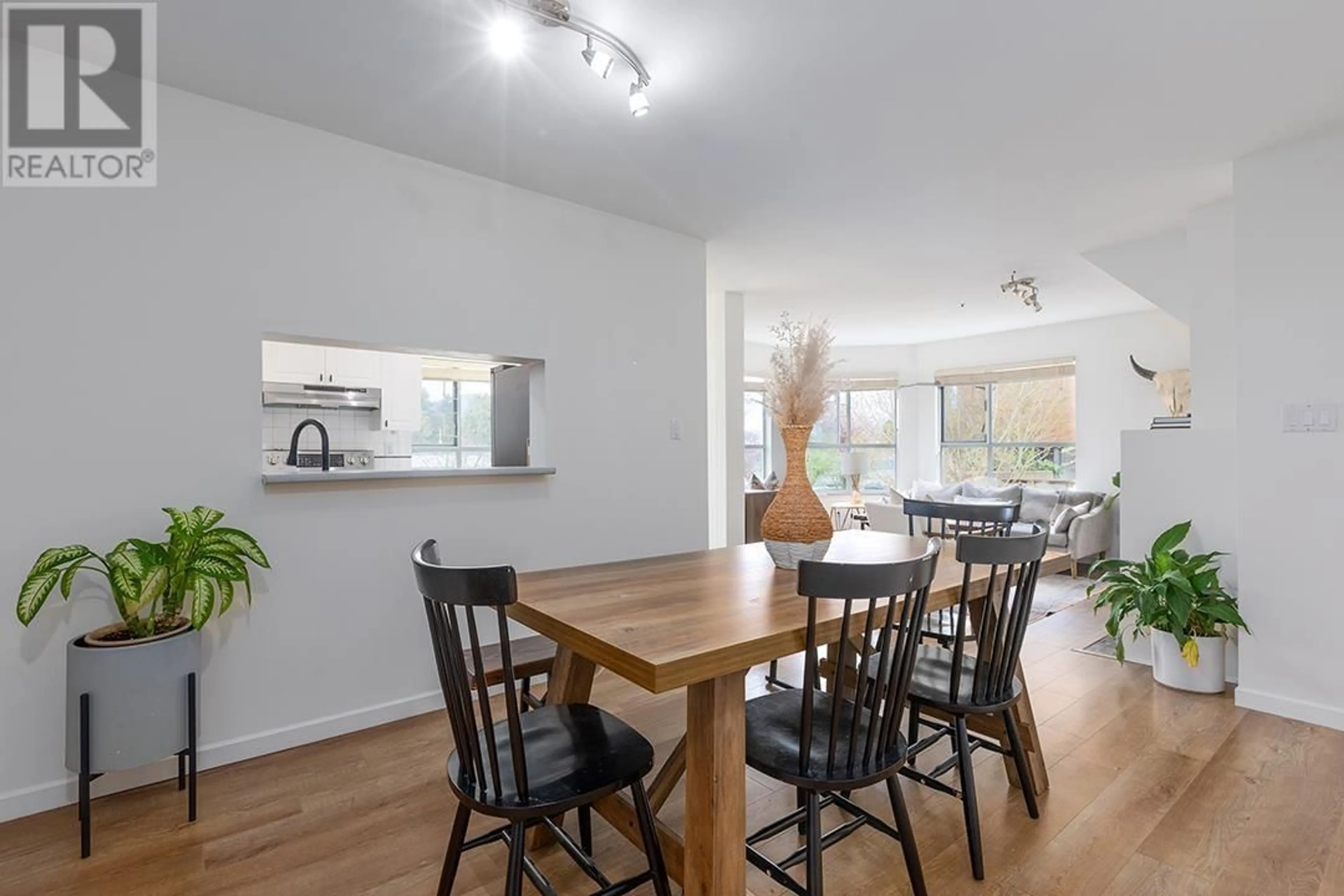 Dining room, wood/laminate floor for 208 - 2285 PITT RIVER ROAD, Port Coquitlam British Columbia V3C1R7