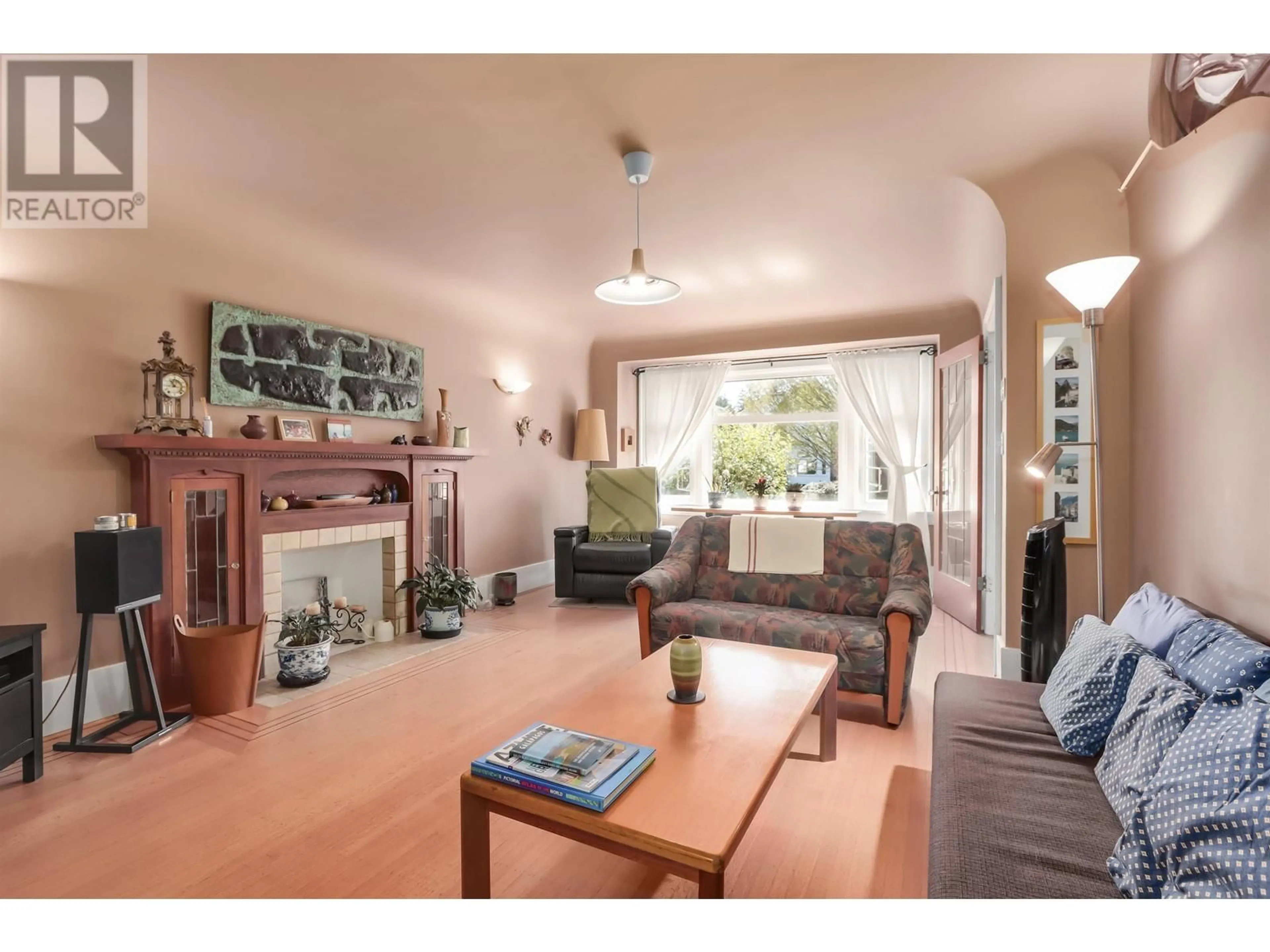 Living room with furniture, wood/laminate floor for 4529 8TH AVENUE, Vancouver British Columbia V6R2A4