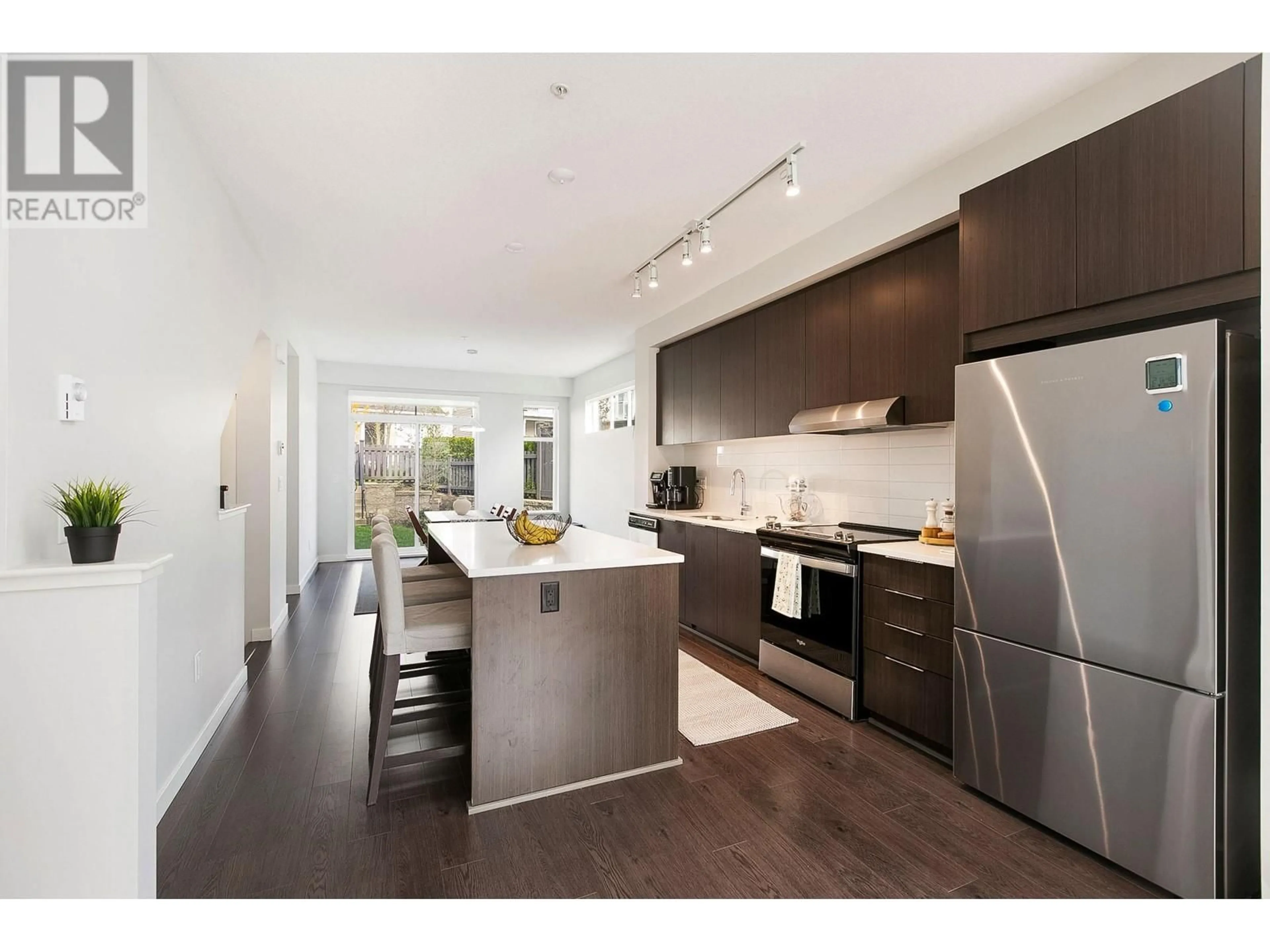 Open concept kitchen, wood/laminate floor for 1041 - 11280 PAZARENA PLACE, Maple Ridge British Columbia V2X9H8