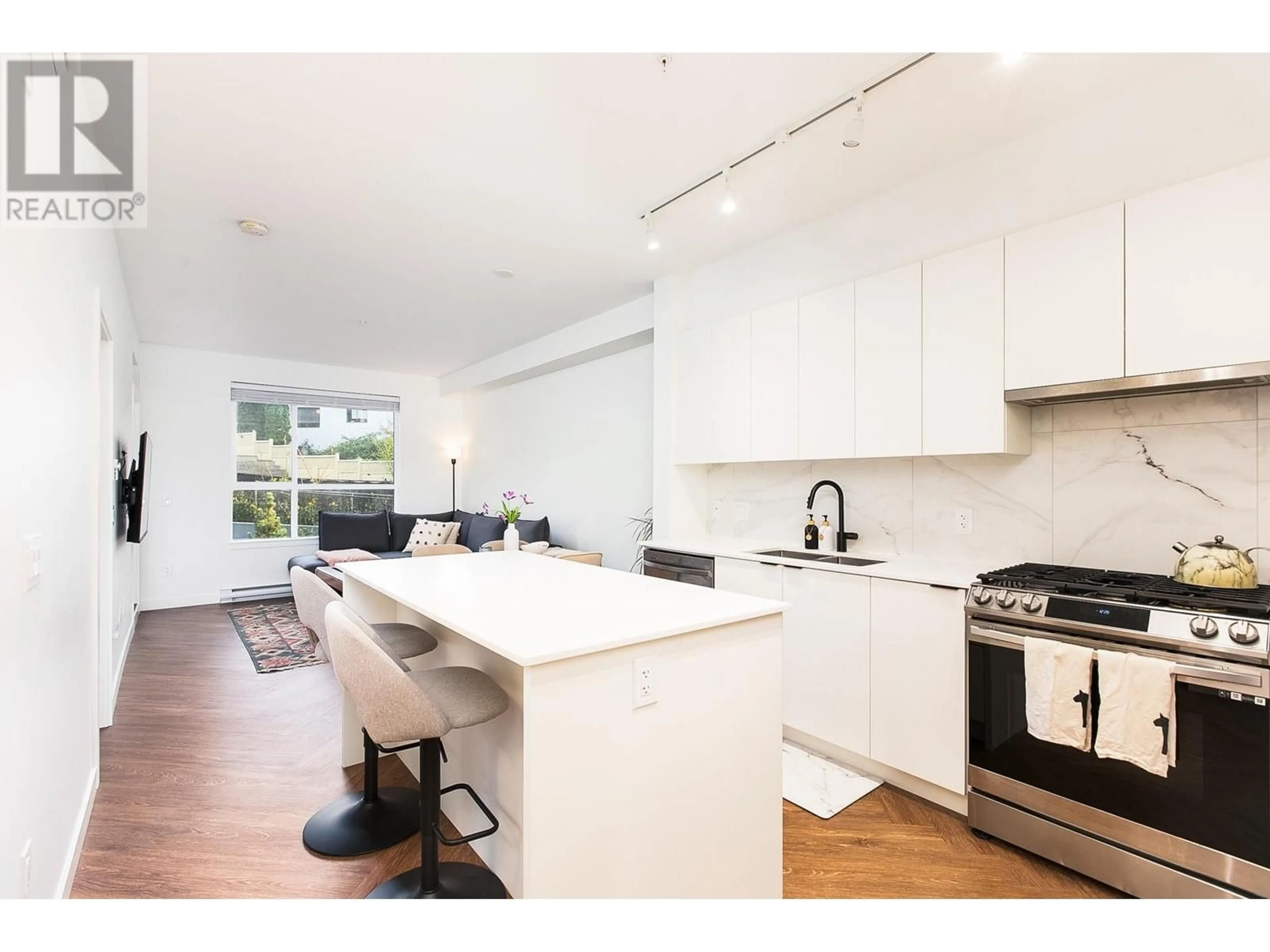 Open concept kitchen, wood/laminate floor for 301 - 3229 ST JOHNS STREET, Port Moody British Columbia V3H0M4