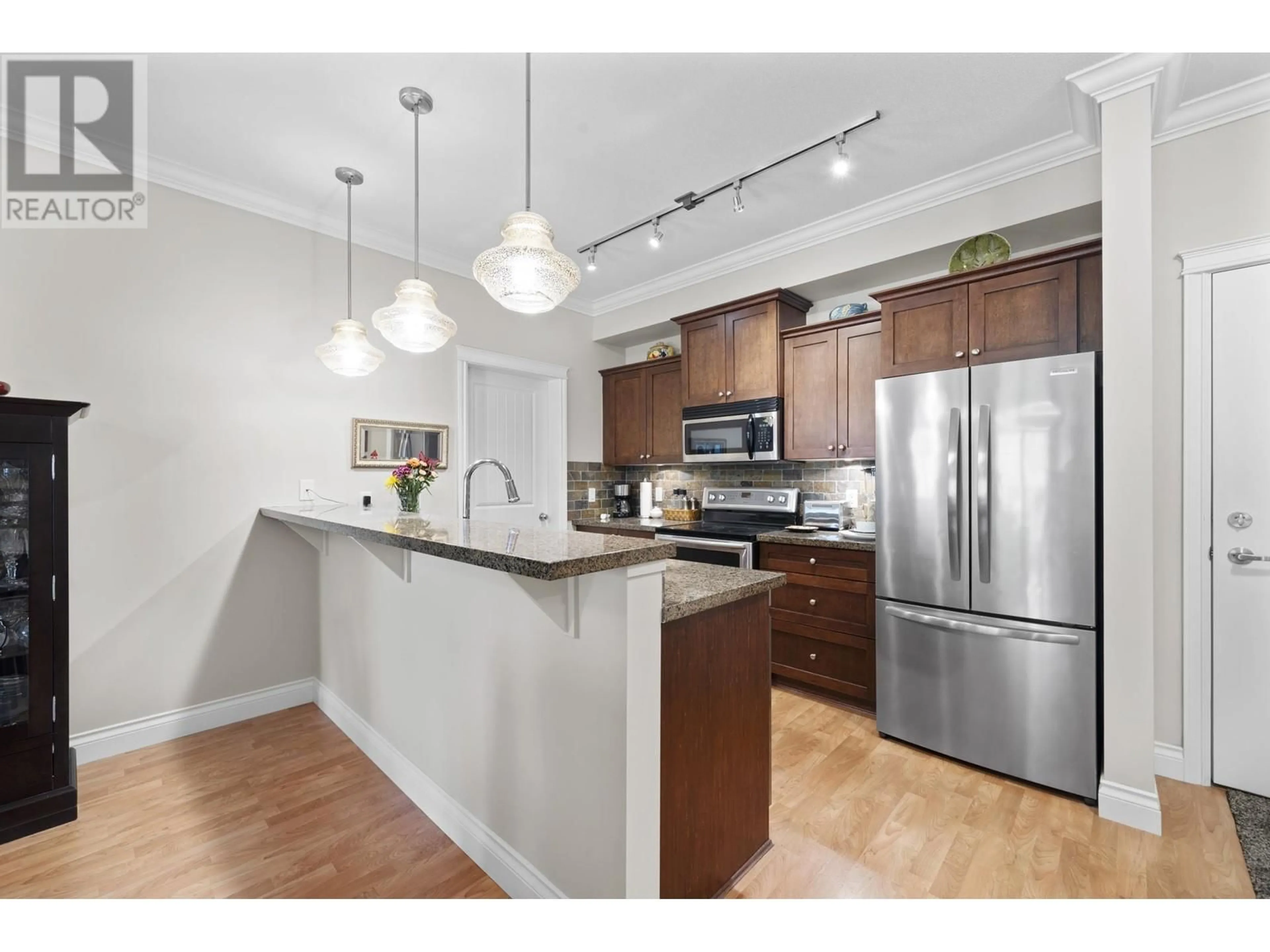 Open concept kitchen, wood/laminate floor for 319 - 12258 224 STREET, Maple Ridge British Columbia V2X8Y7