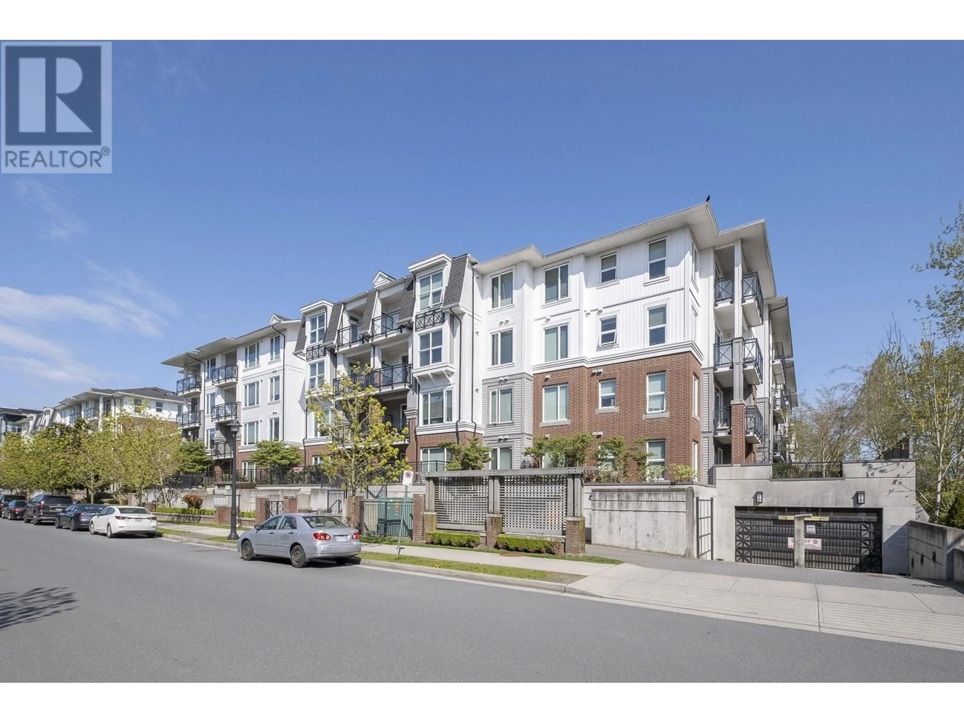 A pic from outside/outdoor area/front of a property/back of a property/a pic from drone, street for 121 - 9399 ODLIN ROAD, Richmond British Columbia V6X0J6