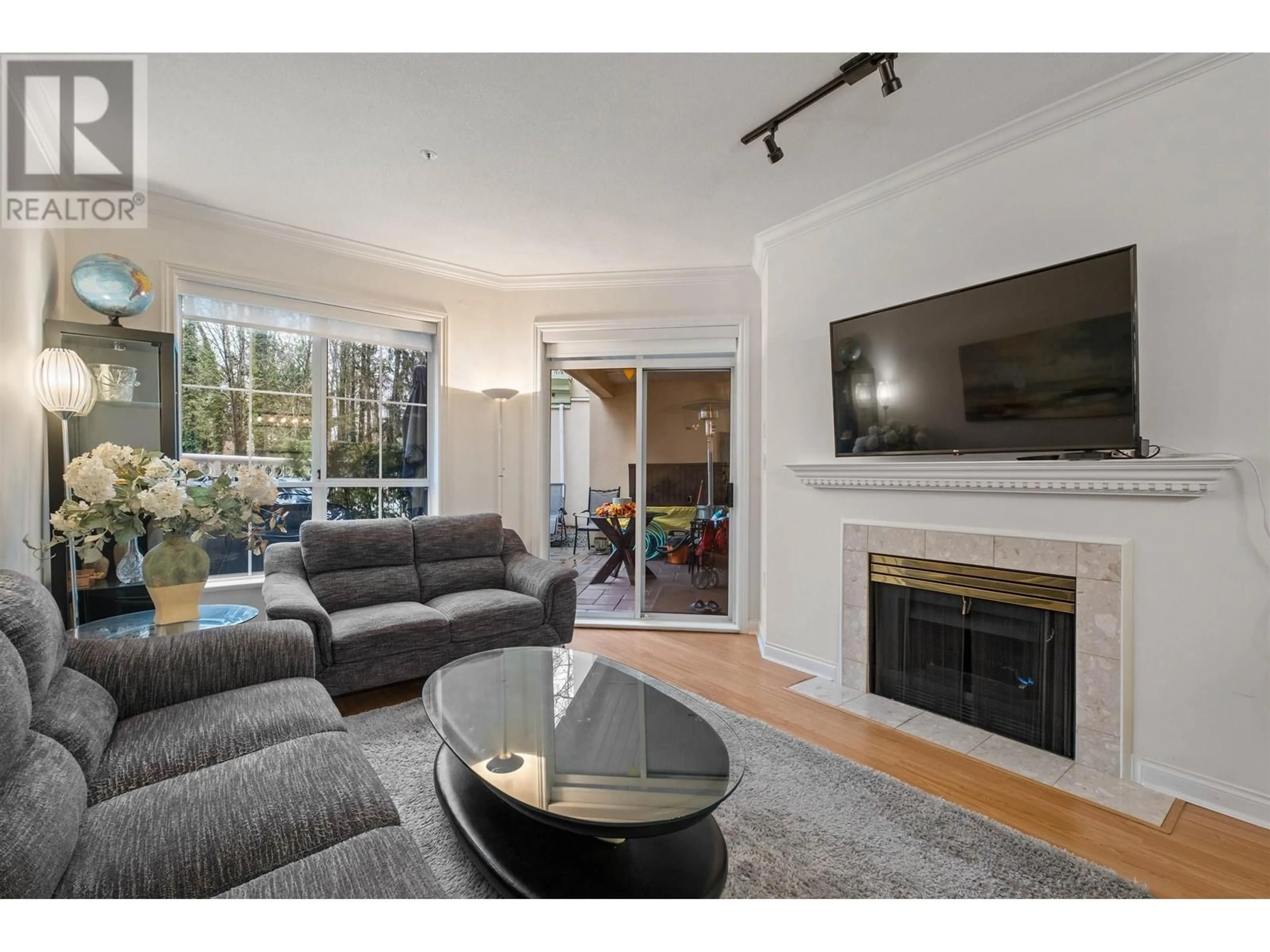 Living room with furniture, wood/laminate floor for 108 - 2995 PRINCESS CRESCENT, Coquitlam British Columbia V3B7N1