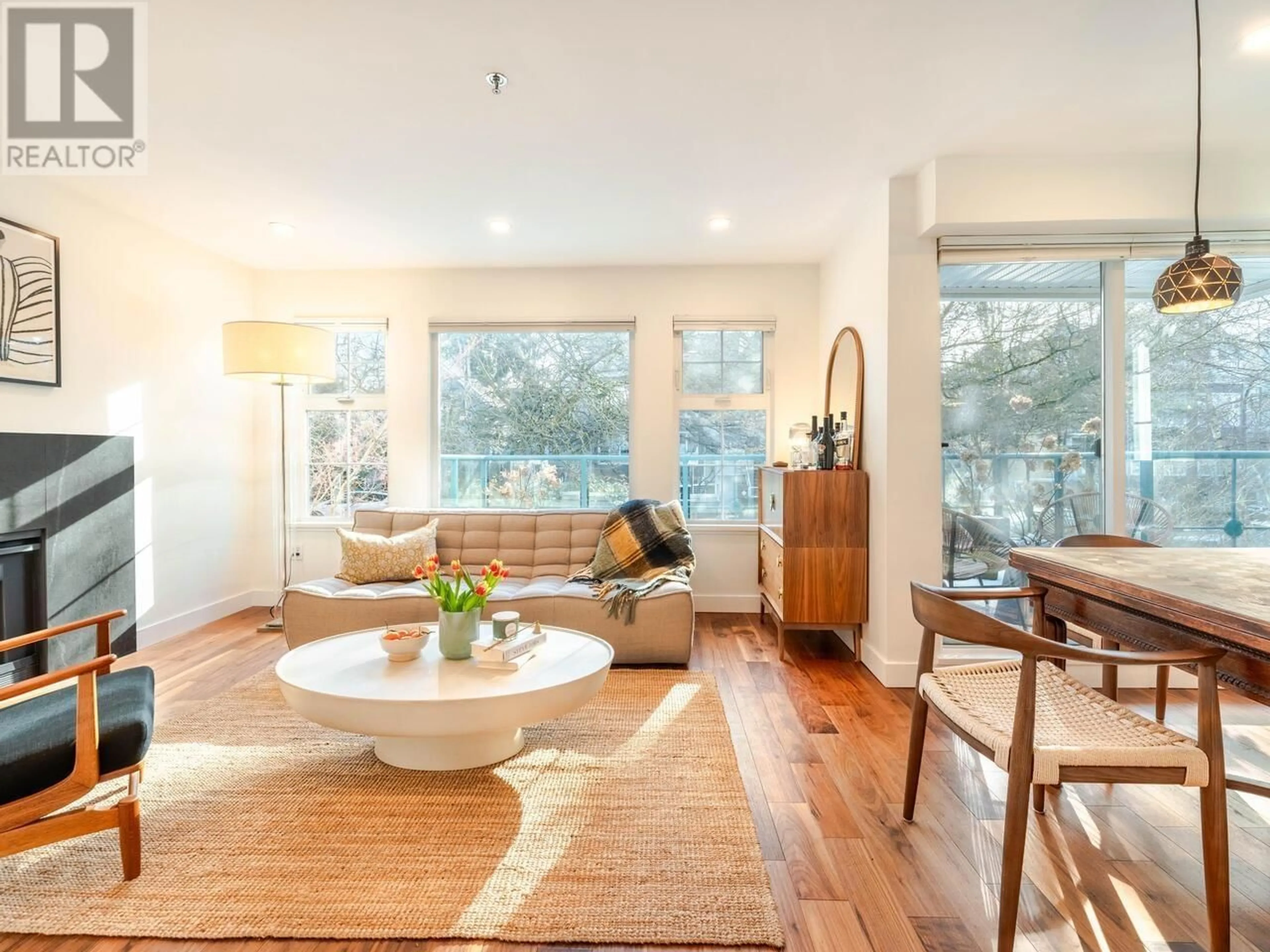 Living room with furniture, wood/laminate floor for 207 - 735 15TH AVENUE, Vancouver British Columbia V5Z1R6