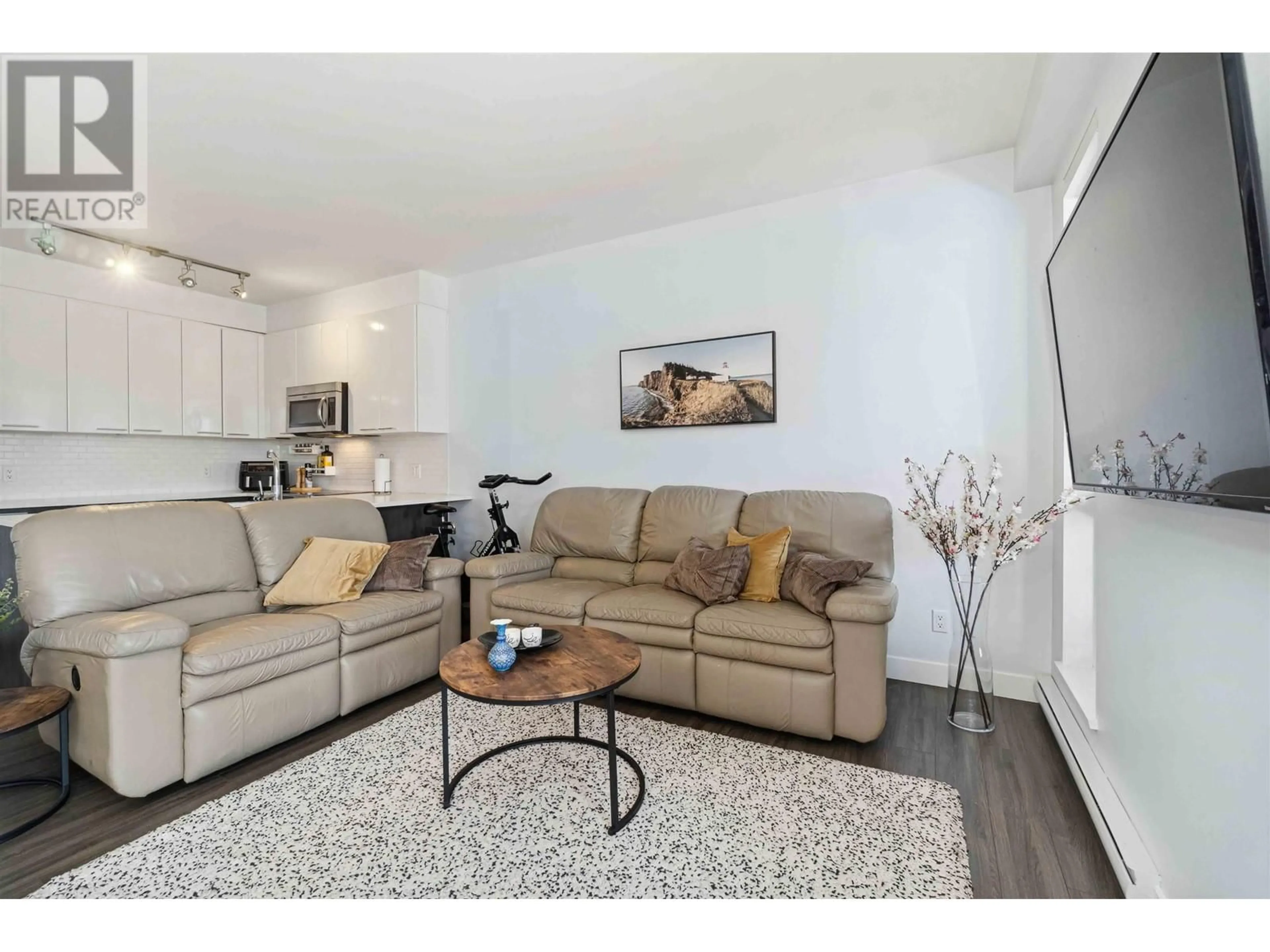 Living room with furniture, wood/laminate floor for 306 - 1201 16TH STREET, North Vancouver British Columbia V7P1R6