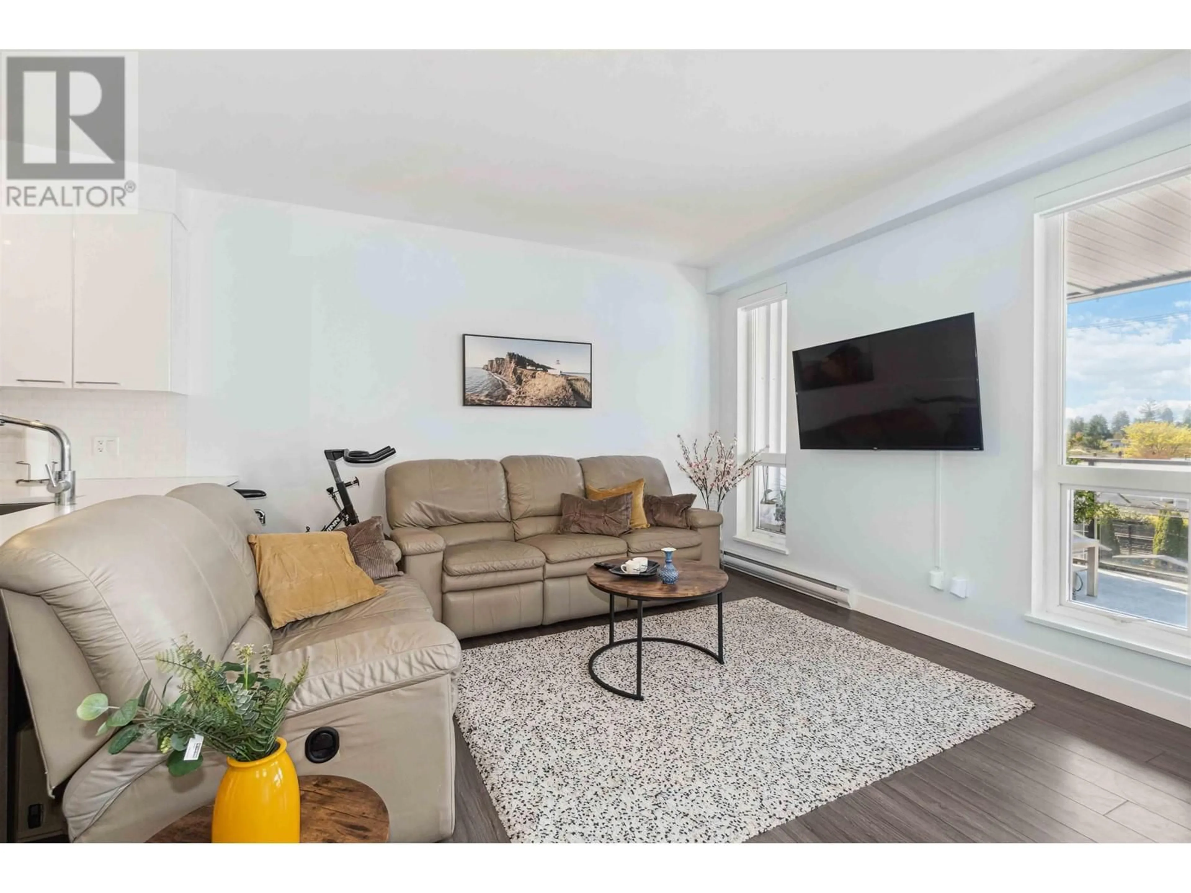 Living room with furniture, wood/laminate floor for 306 - 1201 16TH STREET, North Vancouver British Columbia V7P1R6