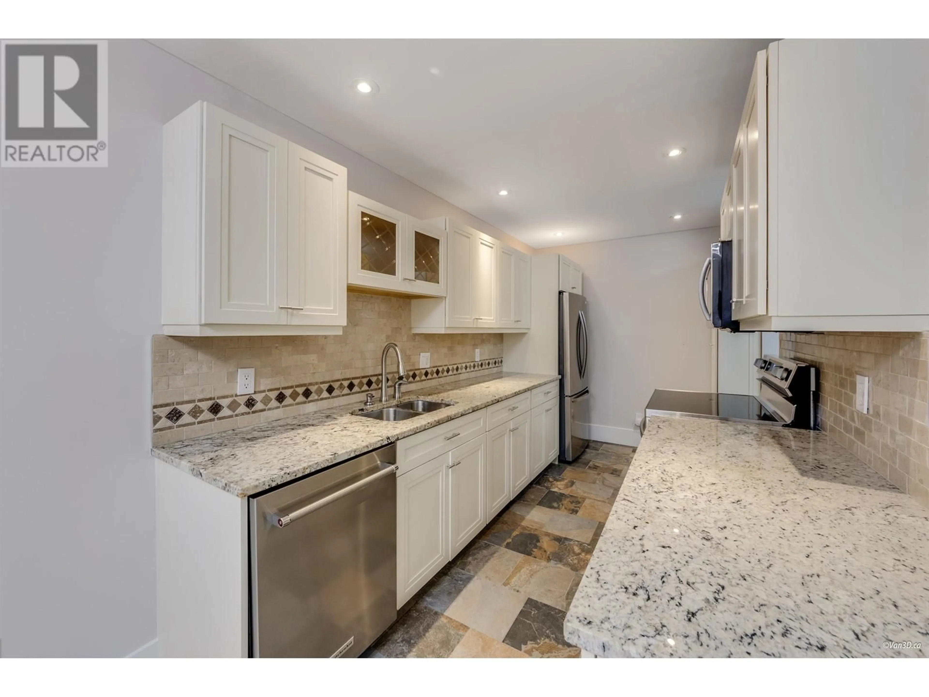 Open concept kitchen, ceramic/tile floor for 113 - 3911 CARRIGAN COURT, Burnaby British Columbia V3N4J7