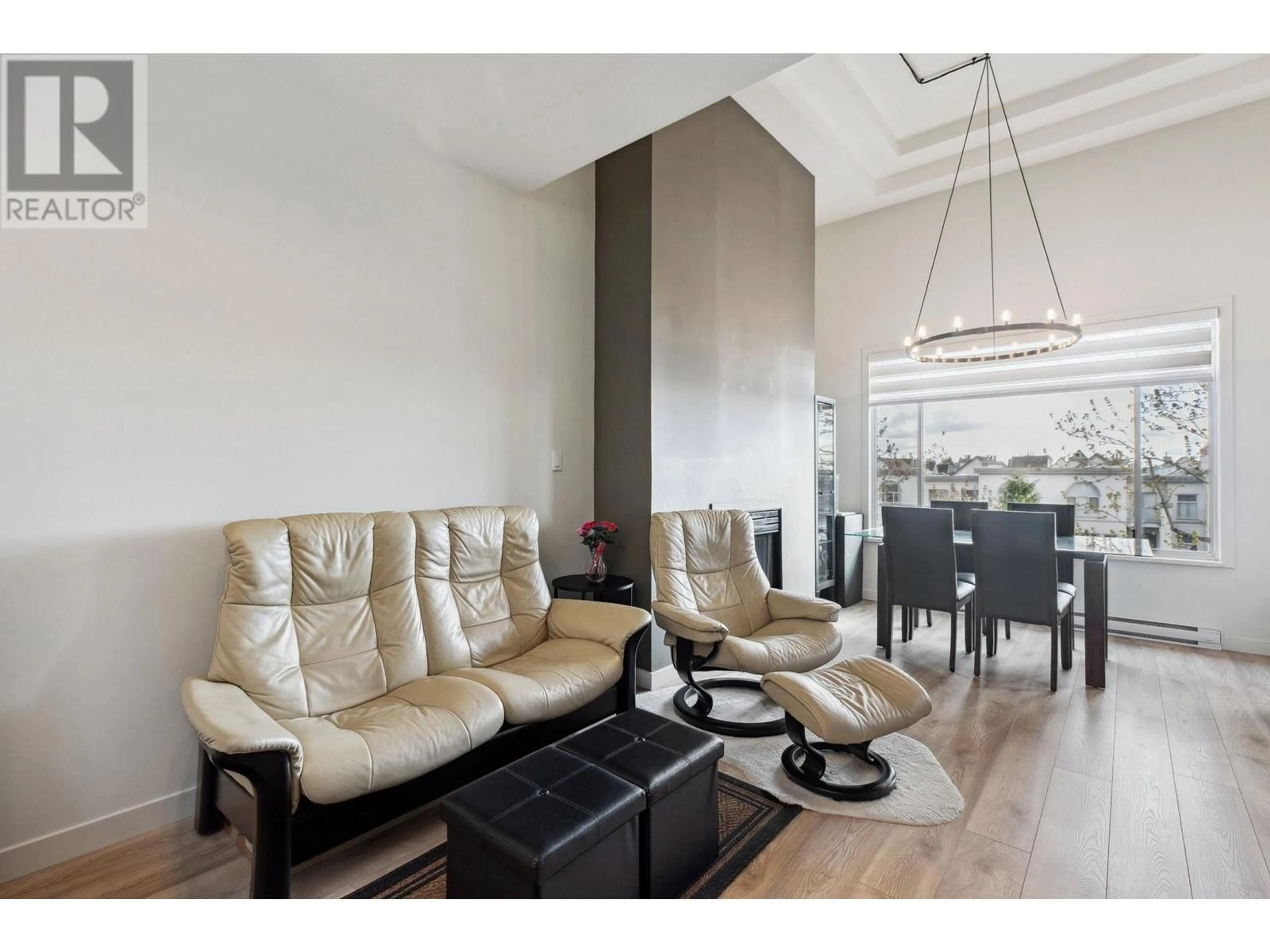 Living room with furniture, wood/laminate floor for 410 - 8220 JONES ROAD, Richmond British Columbia V6Y3Z7