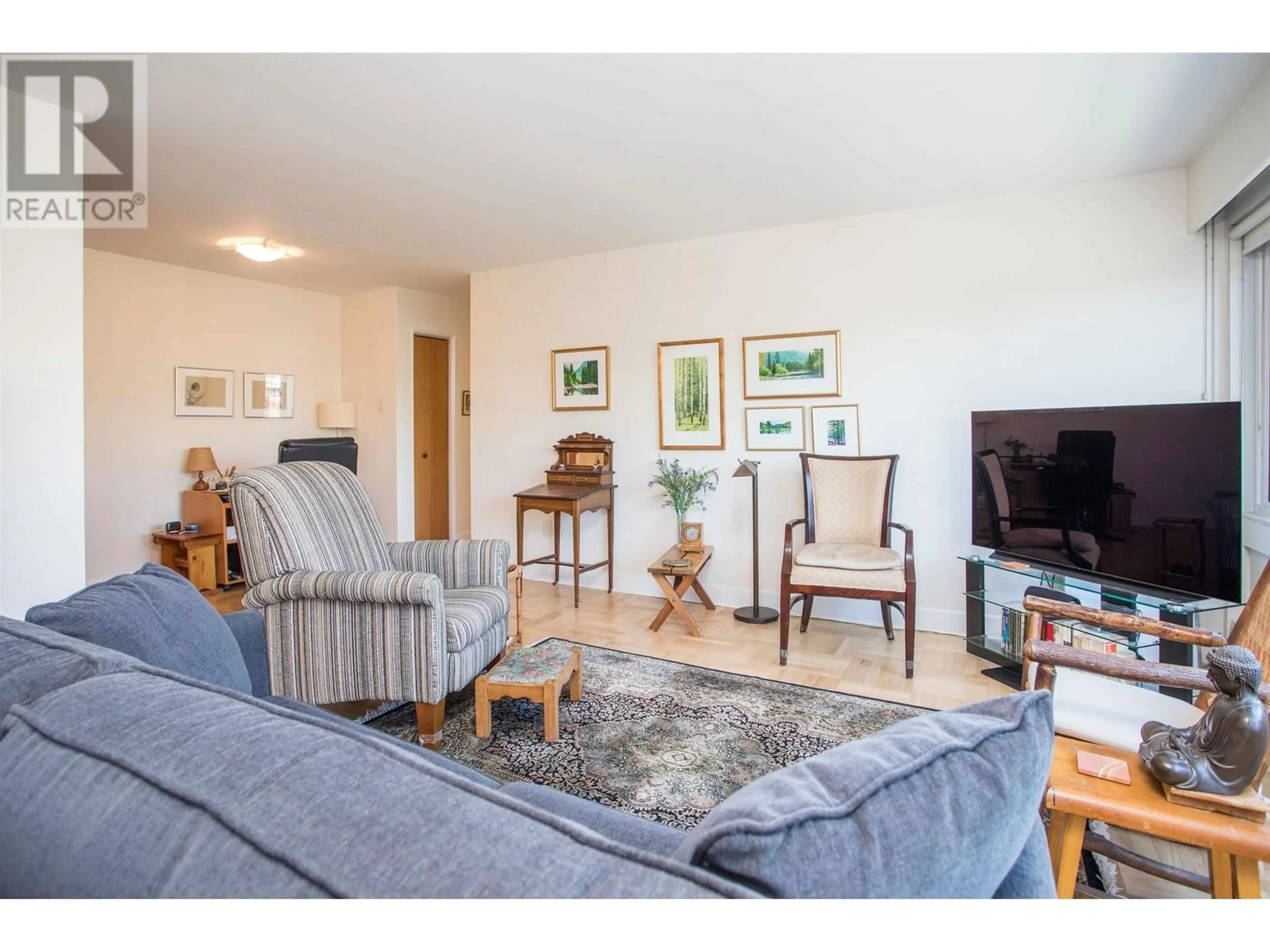 Living room with furniture, wood/laminate floor for 204 - 6076 TISDALL STREET, Vancouver British Columbia V5Z3N2