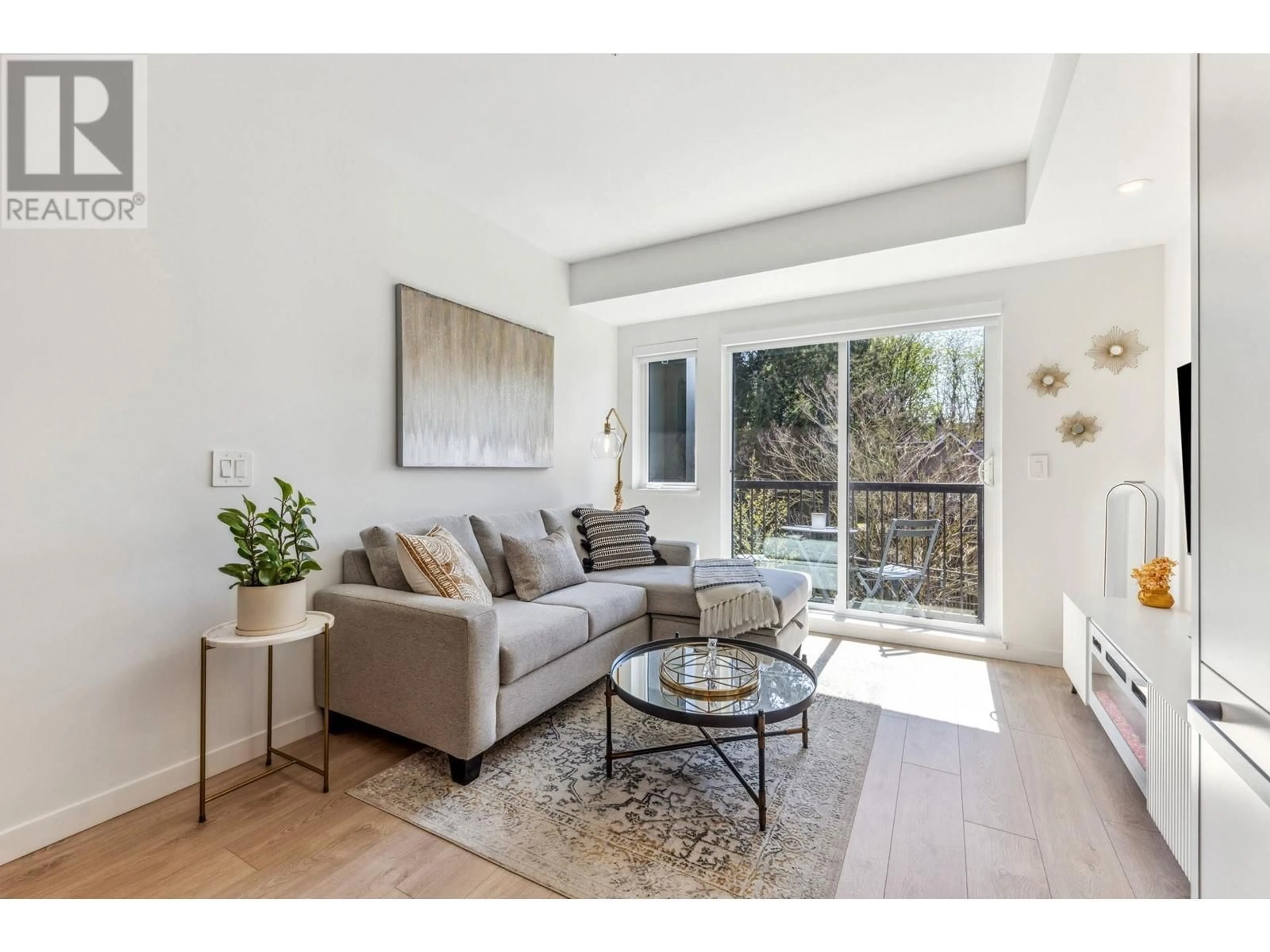 Living room with furniture, wood/laminate floor for 316 - 2520 GUELPH STREET, Vancouver British Columbia V5T0K7