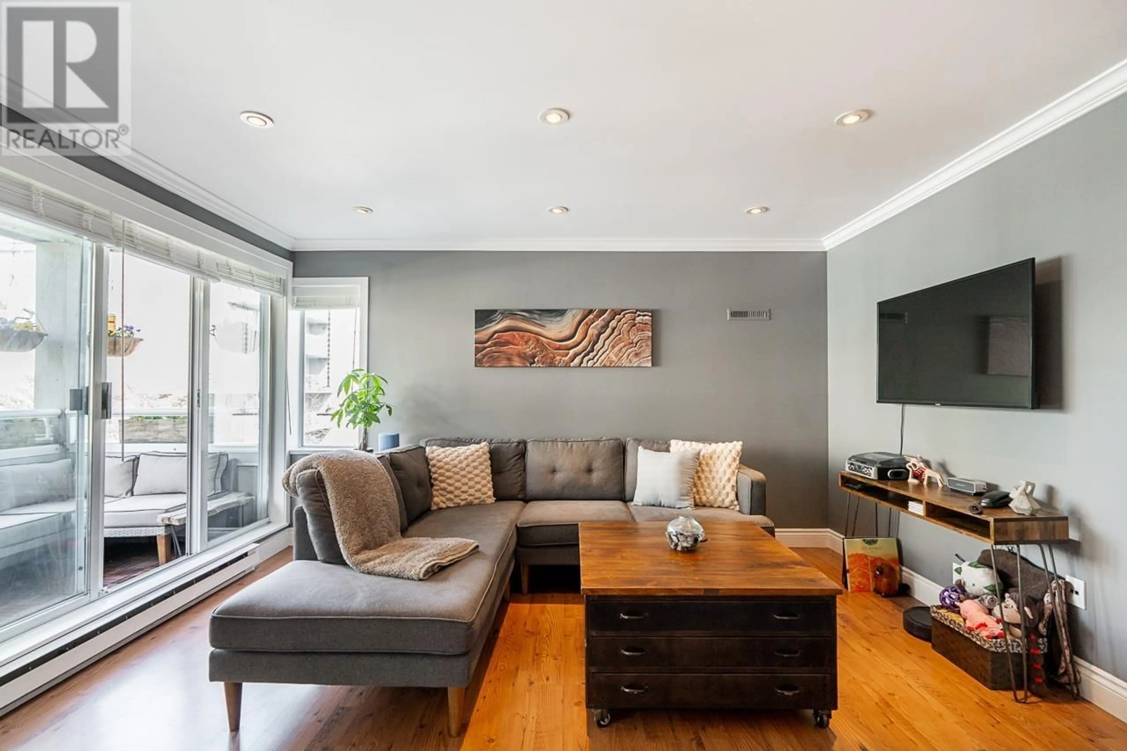 Living room with furniture, wood/laminate floor for 201 - 1845 7TH AVENUE, Vancouver British Columbia V6J1S9