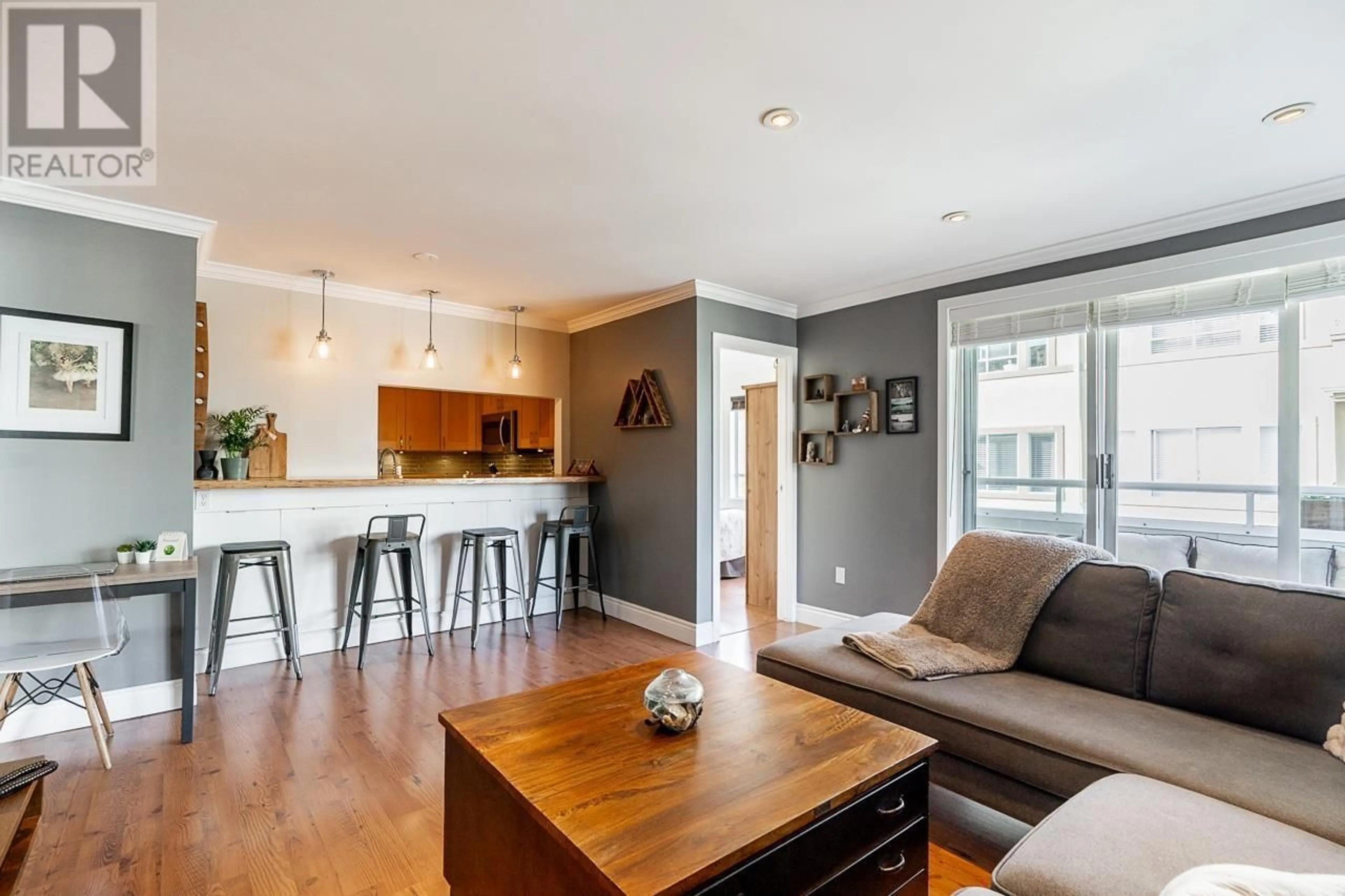 Open concept kitchen, wood/laminate floor for 201 - 1845 7TH AVENUE, Vancouver British Columbia V6J1S9