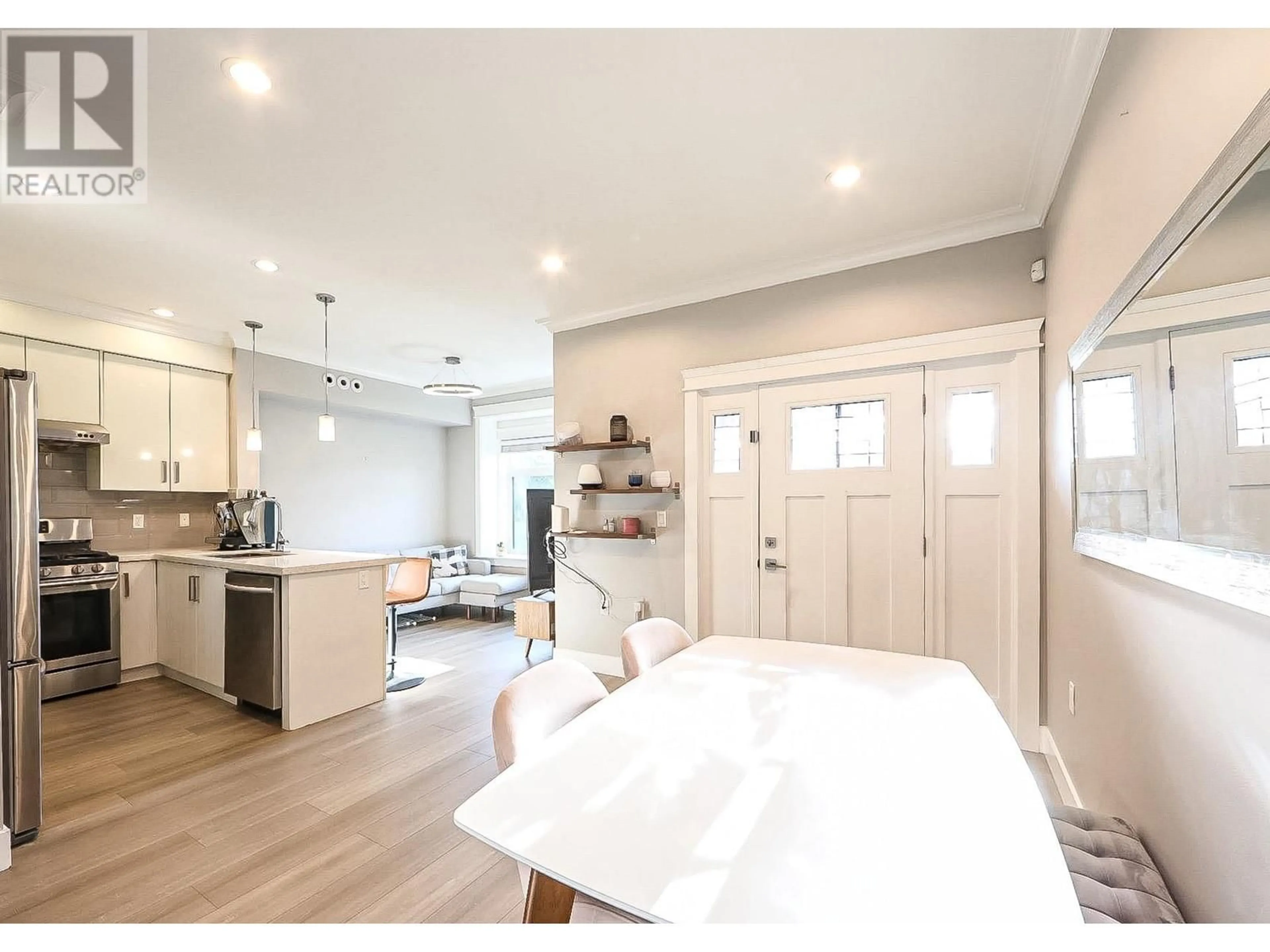 Open concept kitchen, wood/laminate floor for 12 - 9551 NO. 3 ROAD, Richmond British Columbia V7A1W2
