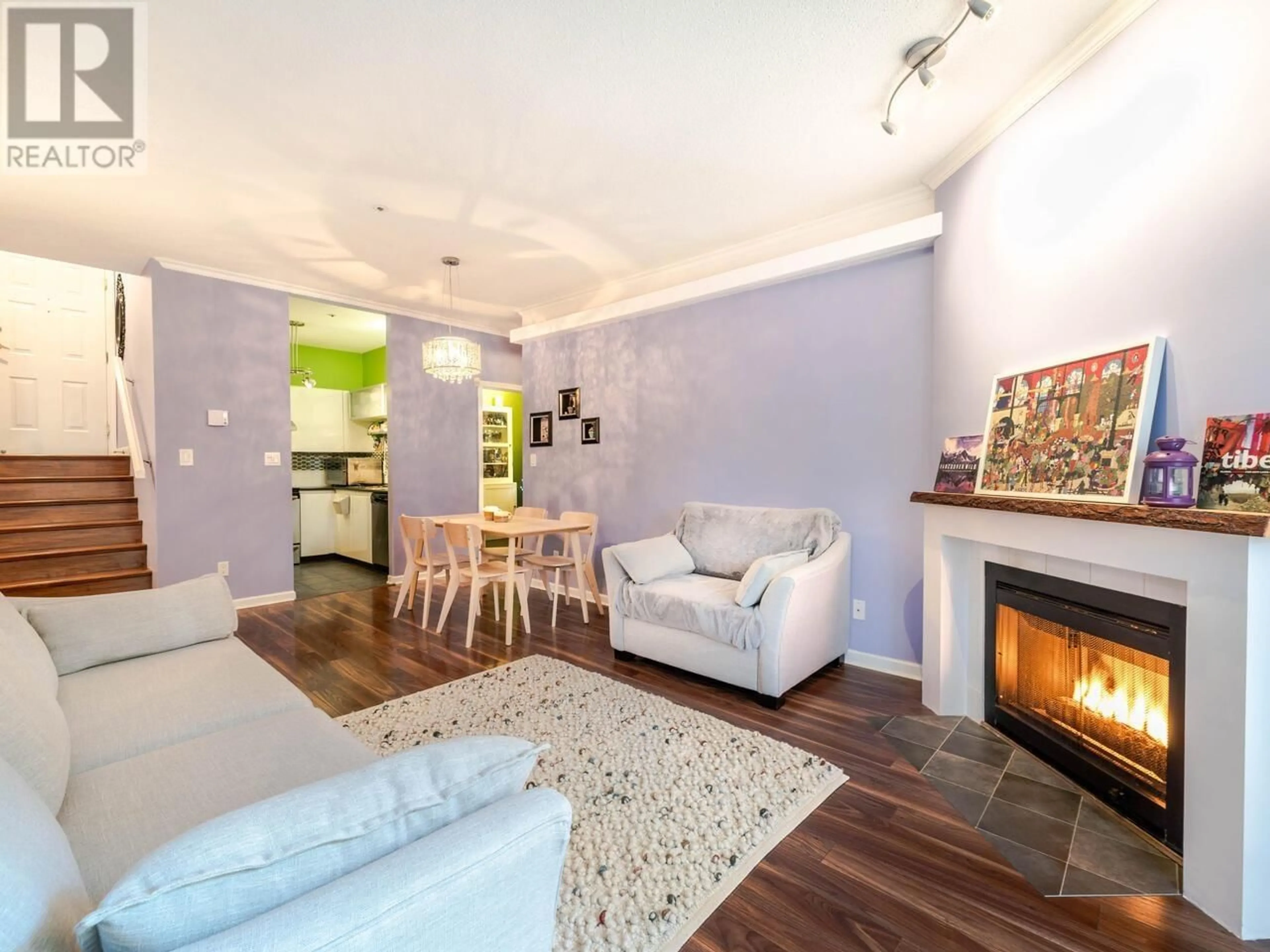 Living room with furniture, wood/laminate floor for 102 - 3680 RAE AVENUE, Vancouver British Columbia V5R2P5
