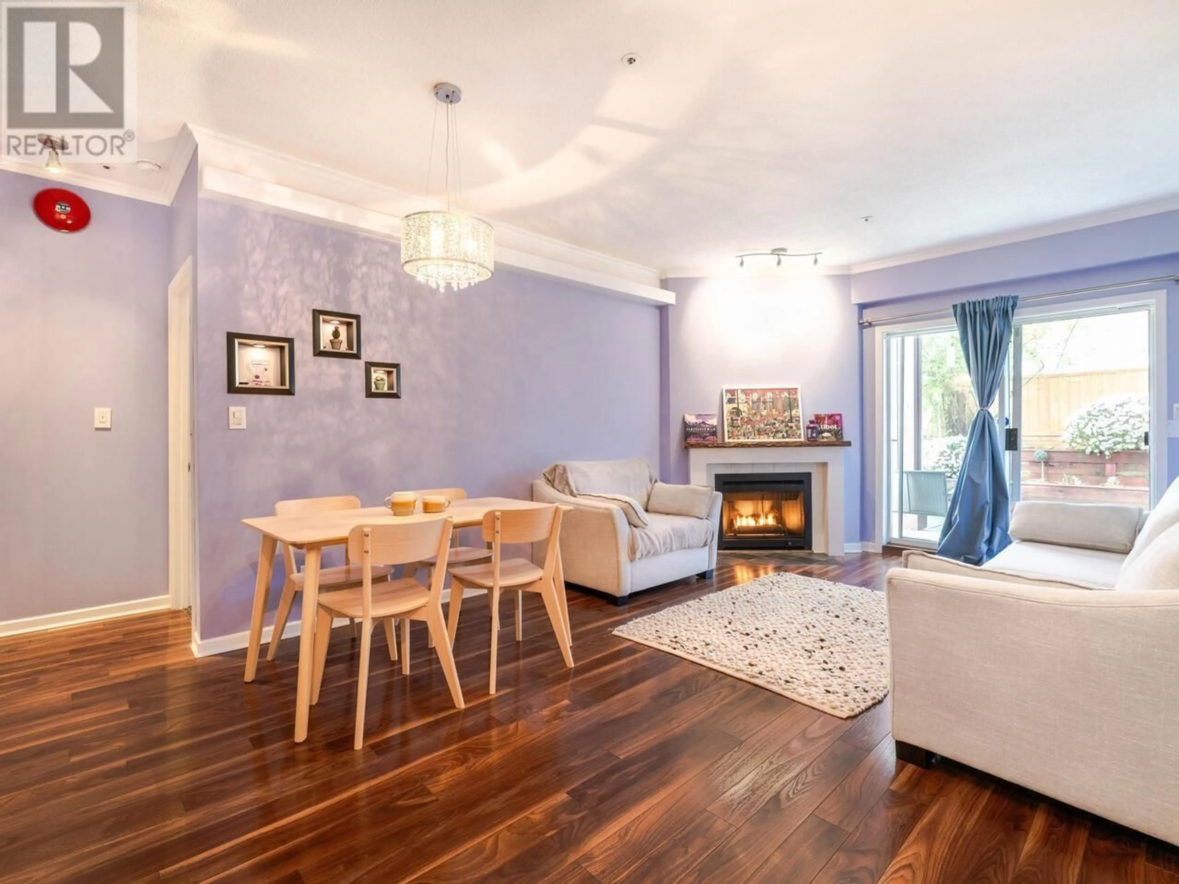 Living room with furniture, wood/laminate floor for 102 - 3680 RAE AVENUE, Vancouver British Columbia V5R2P5