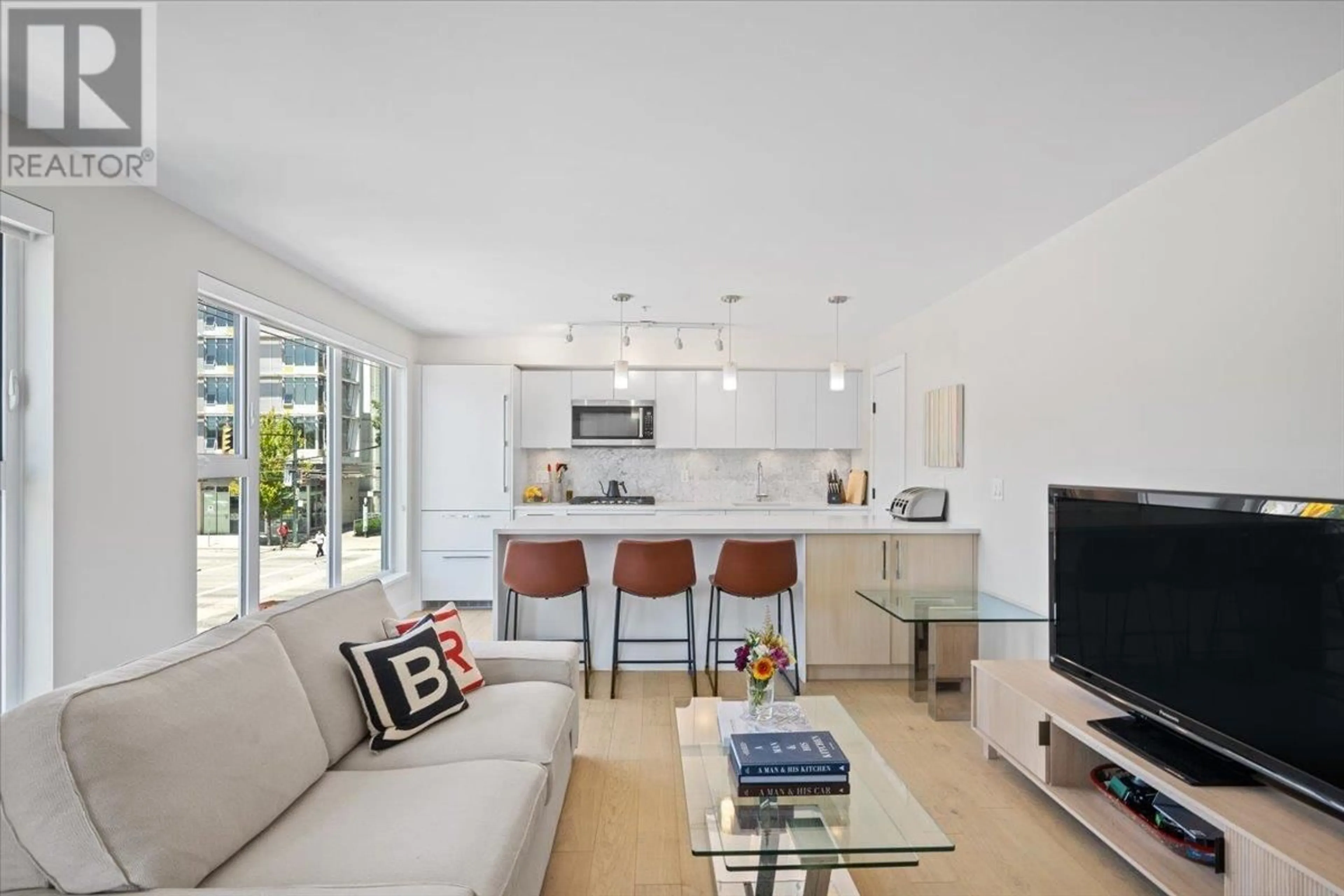 Living room with furniture, unknown for 201 - 2508 FRASER STREET, Vancouver British Columbia V5T3V4