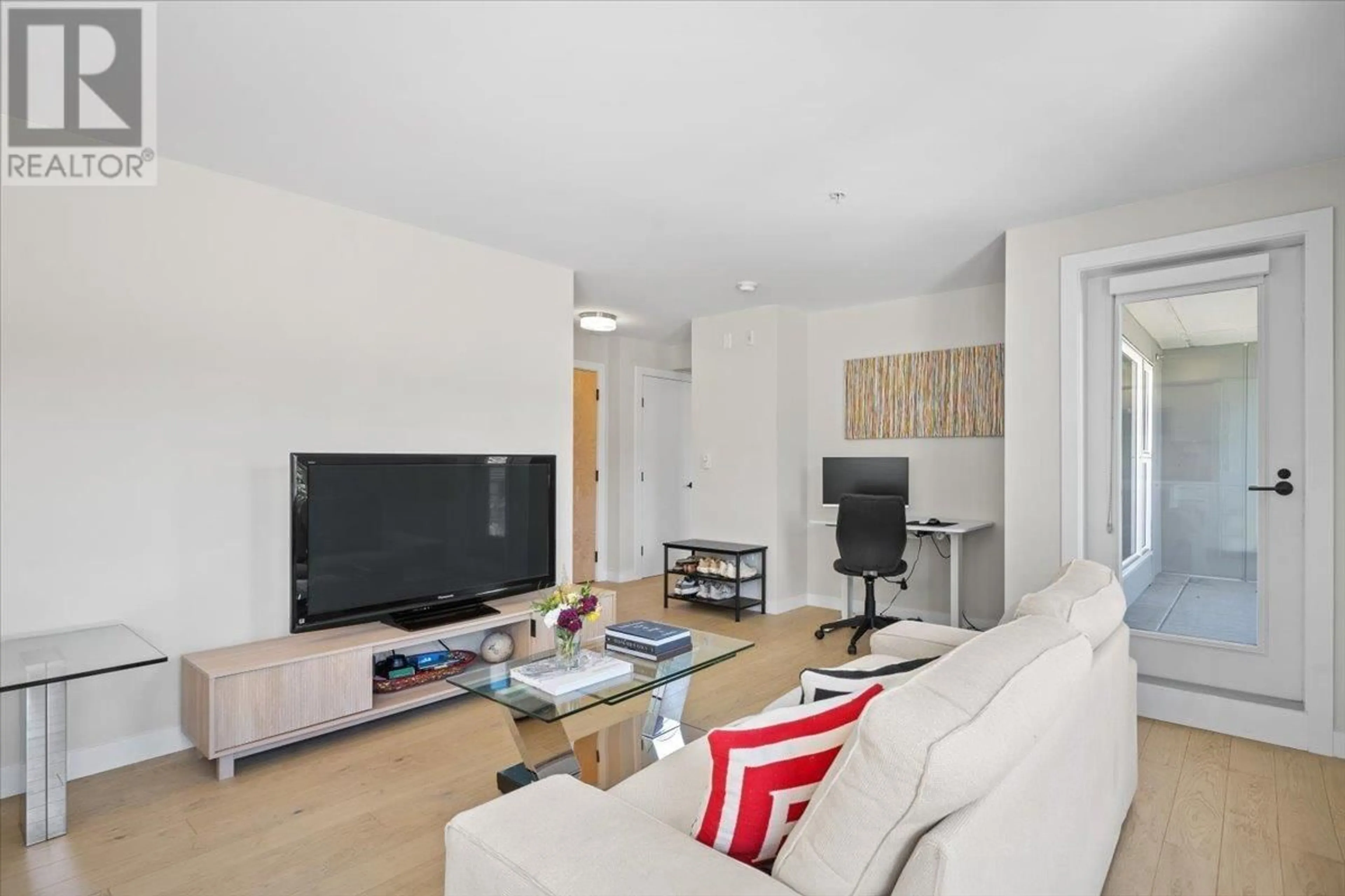 Living room with furniture, unknown for 201 - 2508 FRASER STREET, Vancouver British Columbia V5T3V4
