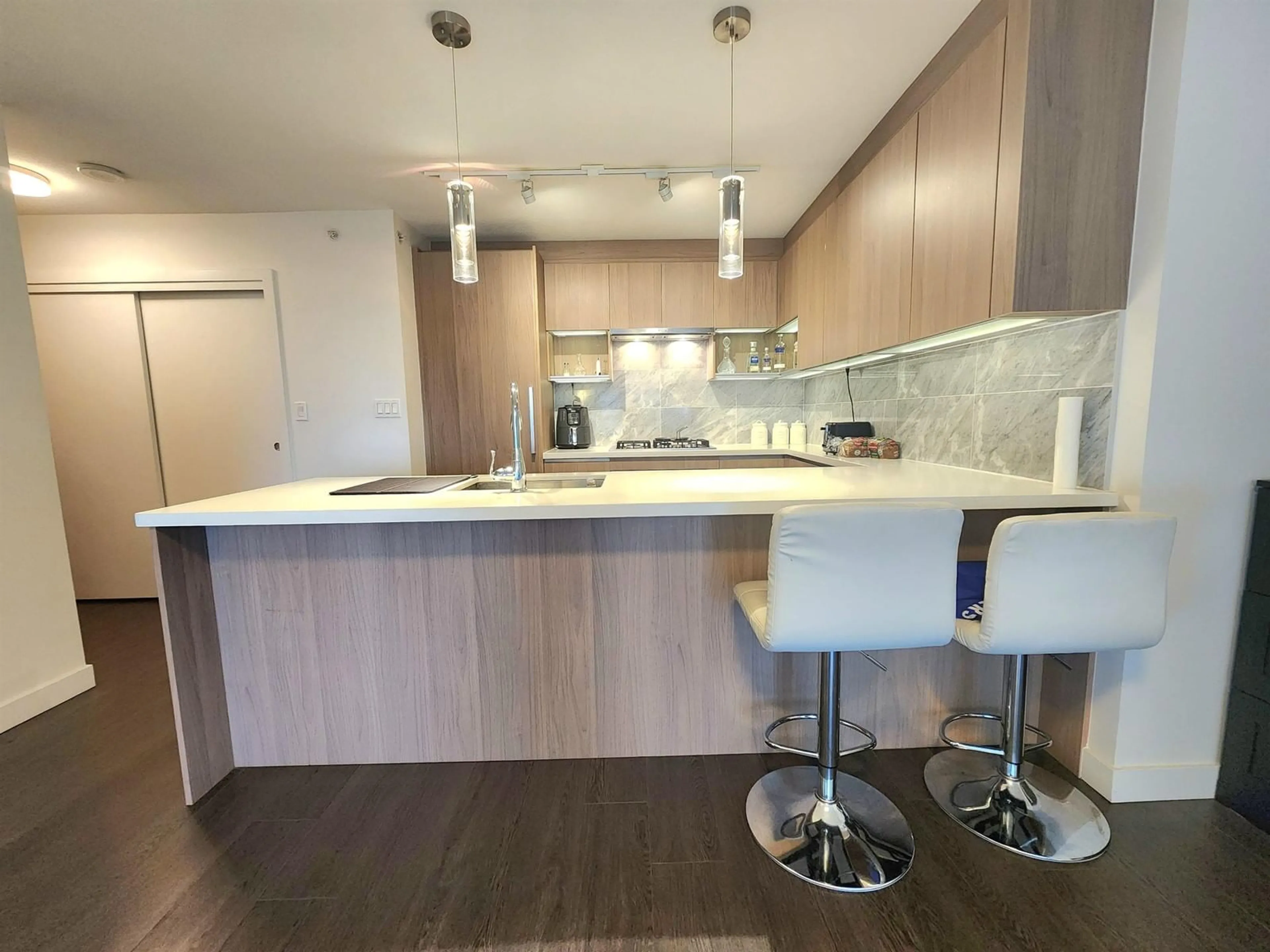 Open concept kitchen, wood/laminate floor for 3106 - 13696 100, Surrey British Columbia V3T0L5