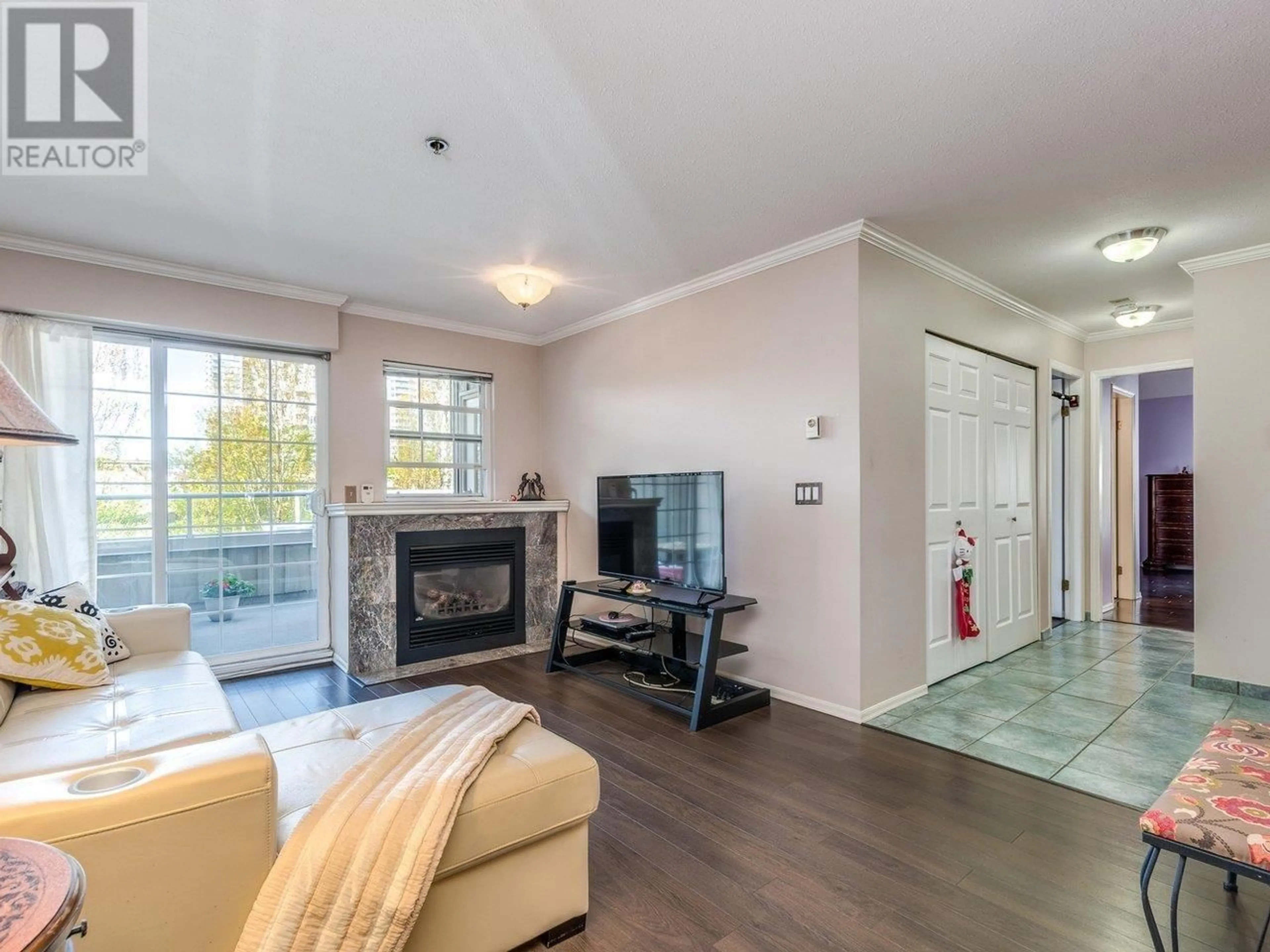 Living room with furniture, wood/laminate floor for 303 - 1154 WESTWOOD STREET, Coquitlam British Columbia V3B7J1
