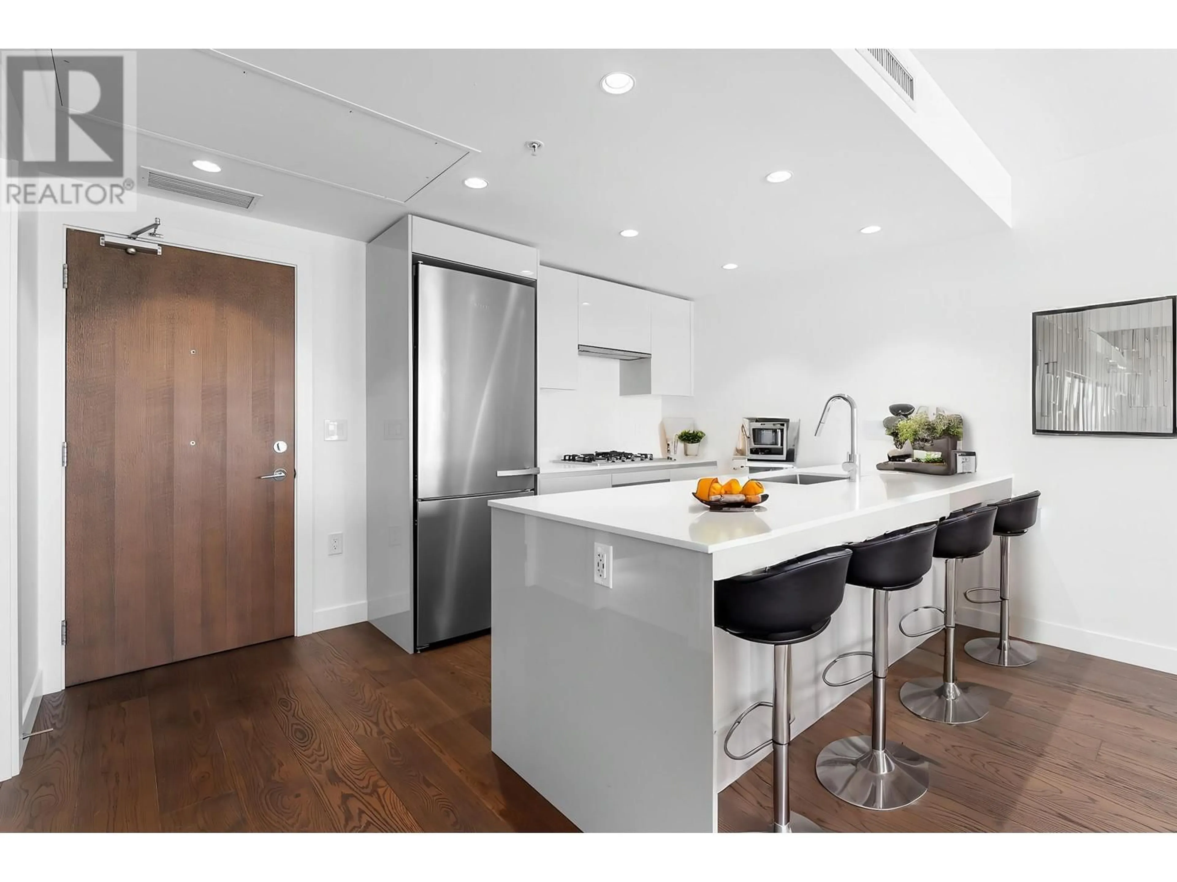 Open concept kitchen, wood/laminate floor for 1505 - 5788 GILBERT ROAD, Richmond British Columbia V7C0G1