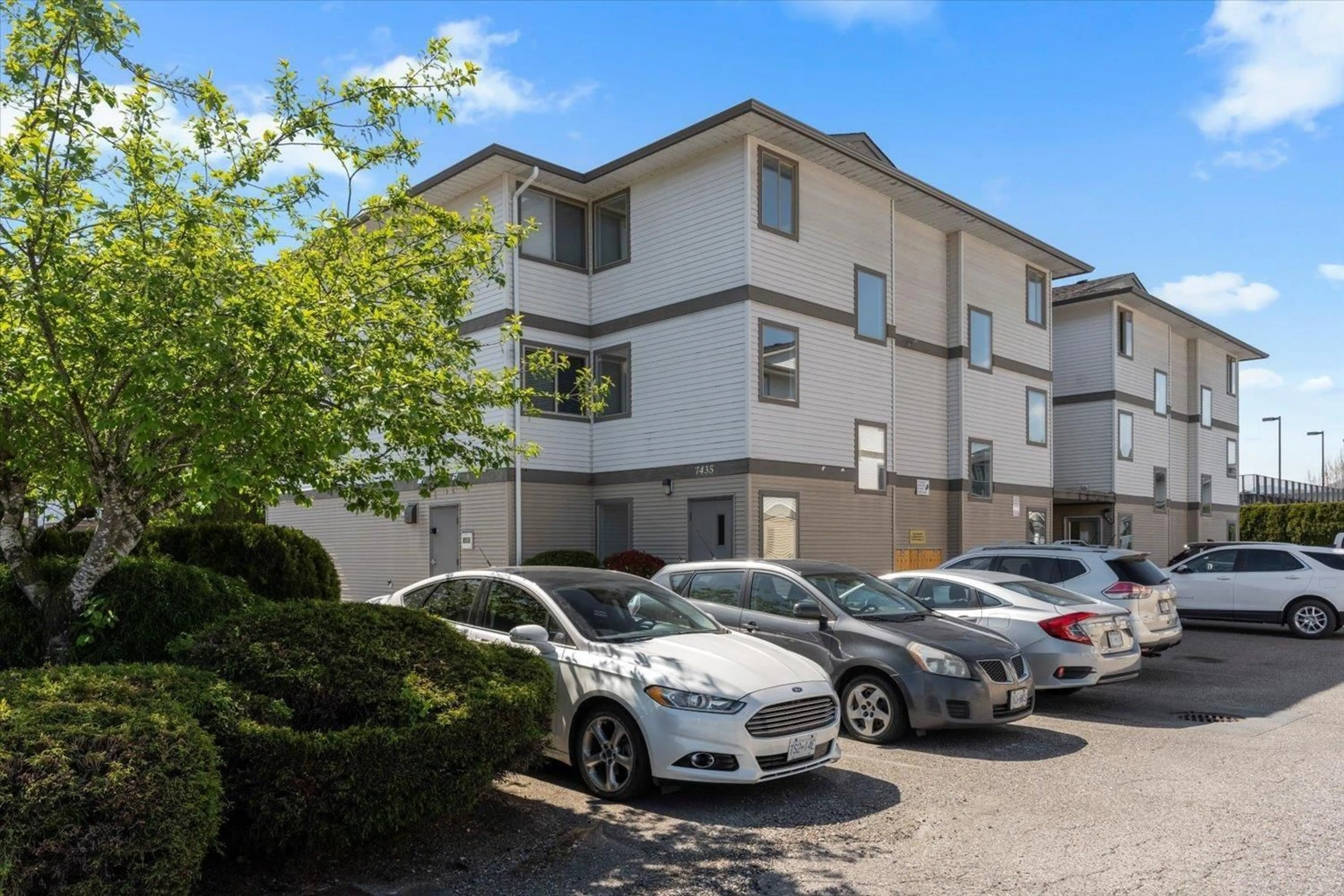 A pic from outside/outdoor area/front of a property/back of a property/a pic from drone, street for 205 - 7435 SHAW AVENUE, Chilliwack British Columbia V2R3C1