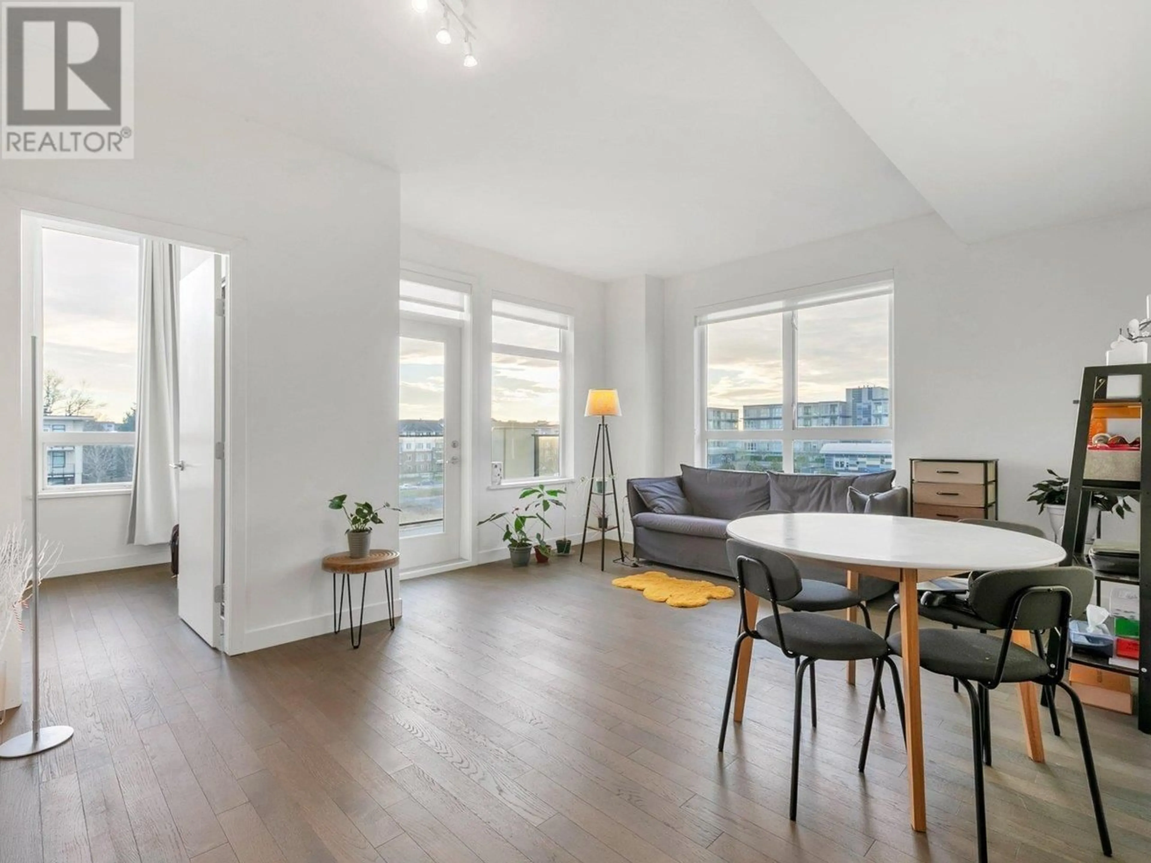 Living room with furniture, wood/laminate floor for 412 - 4033 MAY DRIVE, Richmond British Columbia V6X0T3