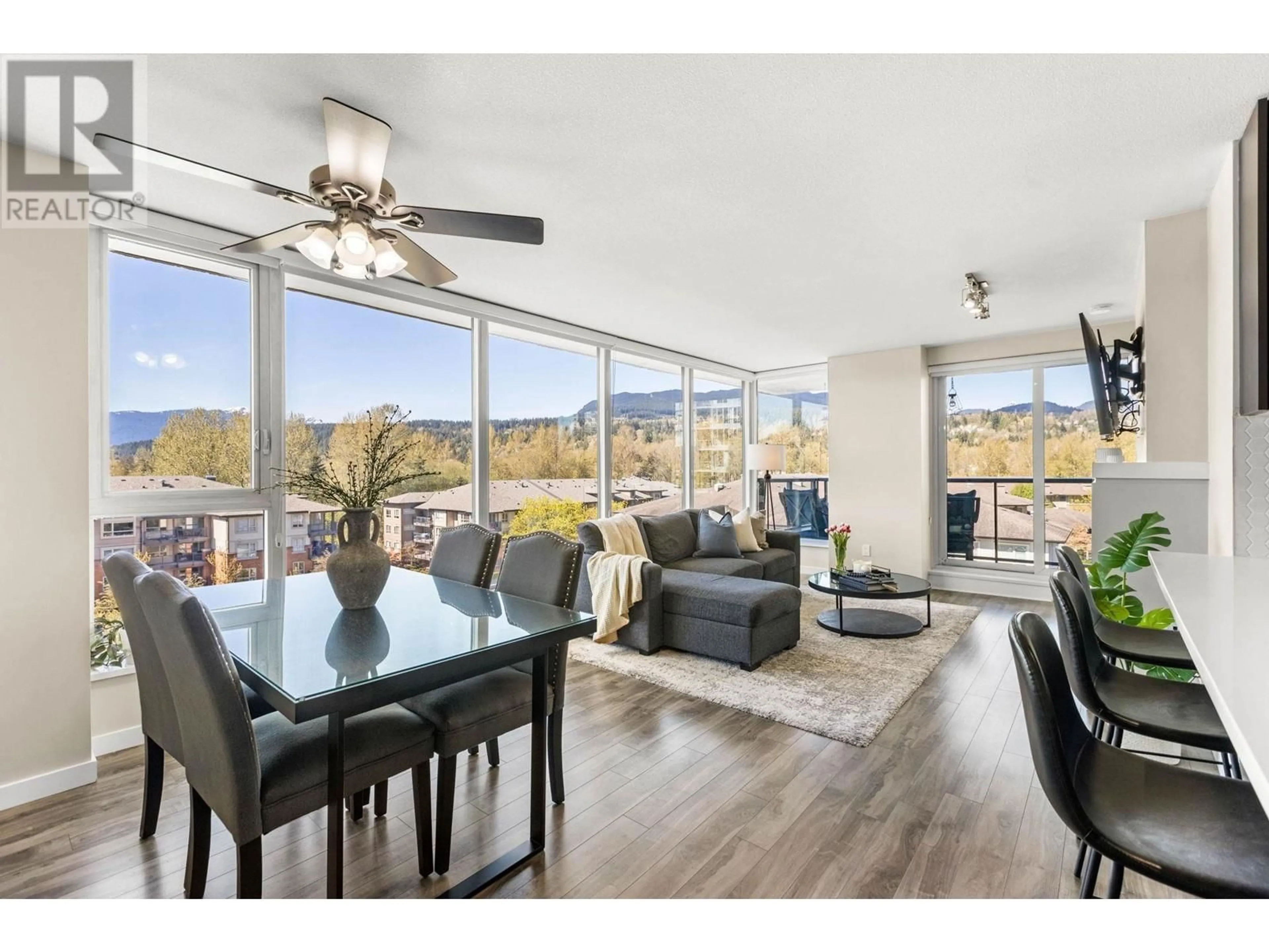 Living room with furniture, wood/laminate floor for 706 - 651 NOOTKA WAY, Port Moody British Columbia V3H0A1