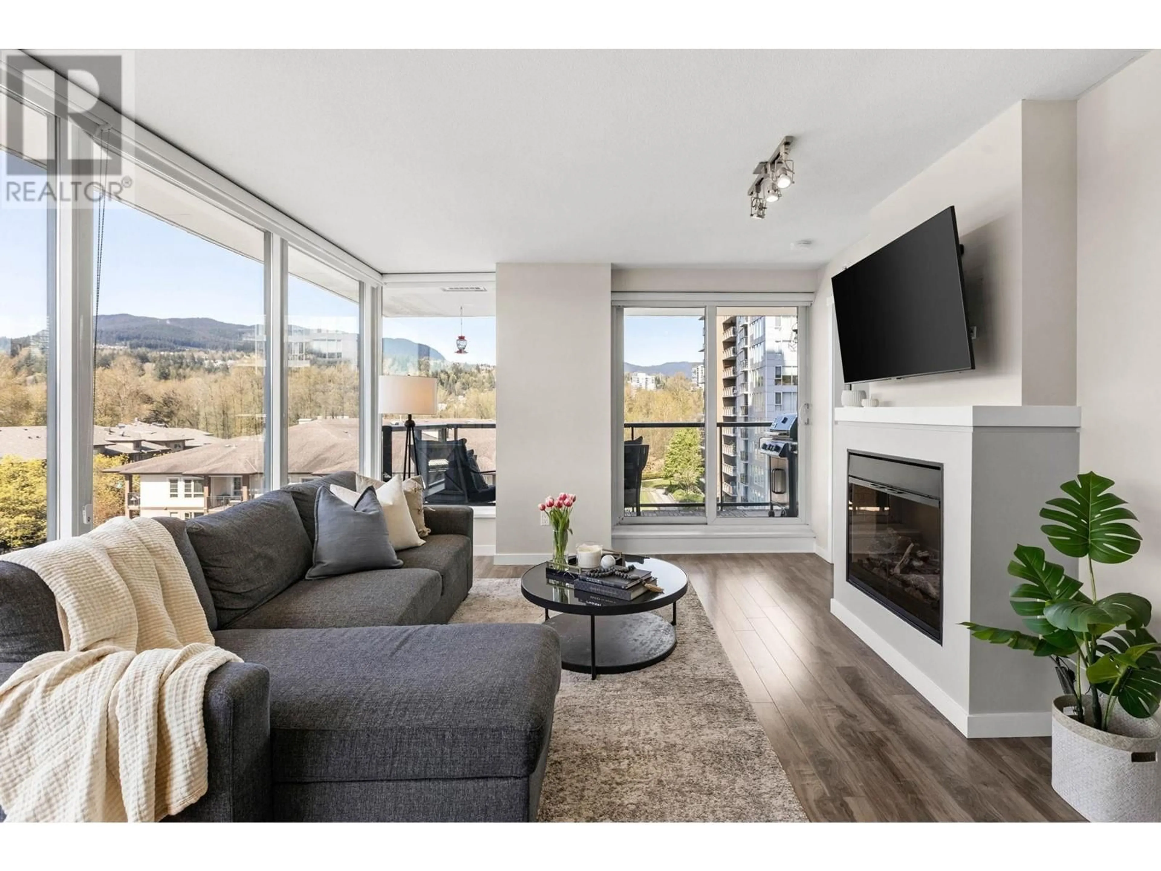 Living room with furniture, wood/laminate floor for 706 - 651 NOOTKA WAY, Port Moody British Columbia V3H0A1