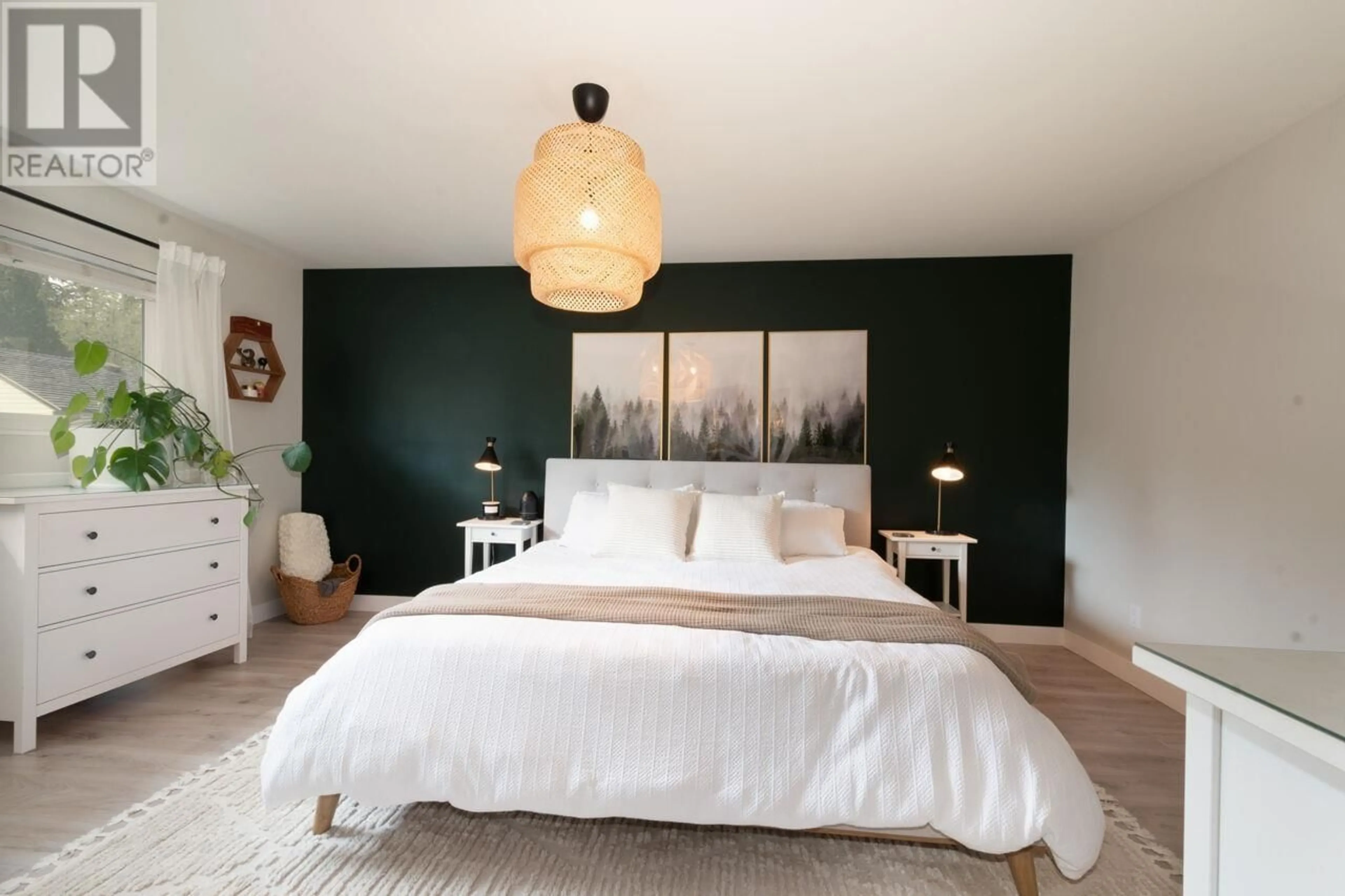 Bedroom with bed, wood/laminate floor for 1503 NORTON COURT, North Vancouver British Columbia V7G2E5