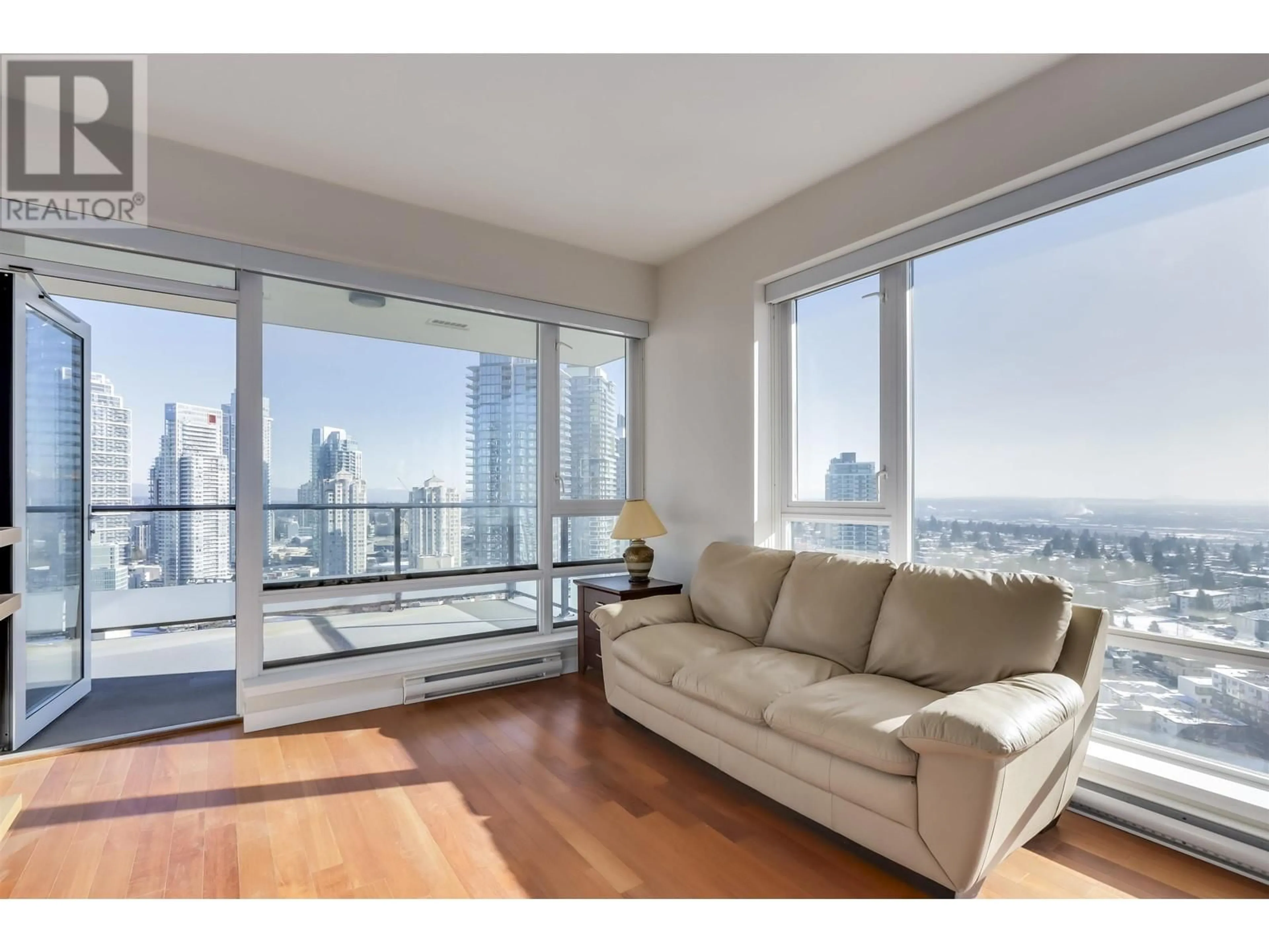 Living room with furniture, wood/laminate floor for 2504 - 6188 WILSON AVENUE, Burnaby British Columbia V5H0A5