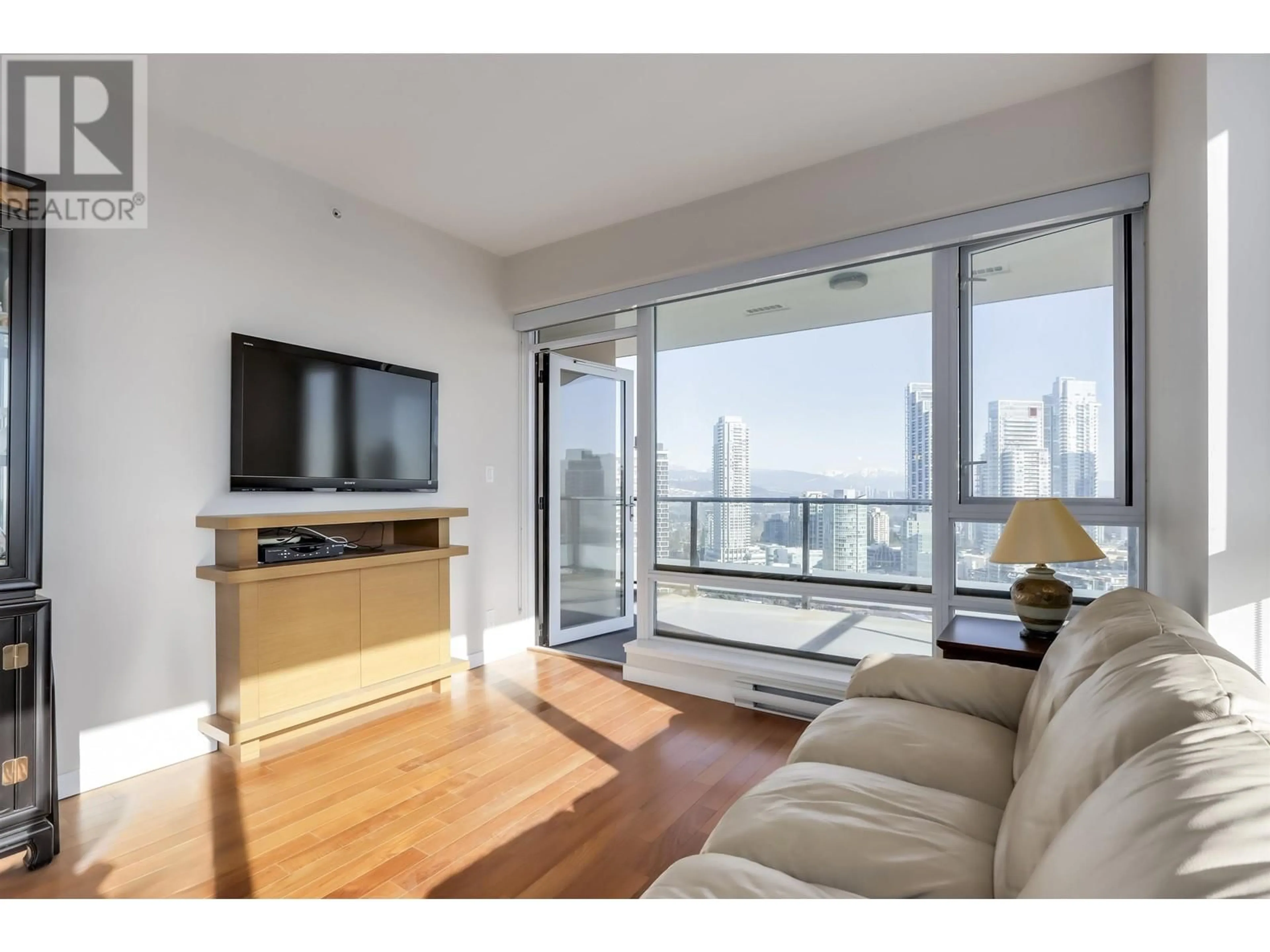 Living room with furniture, wood/laminate floor for 2504 - 6188 WILSON AVENUE, Burnaby British Columbia V5H0A5