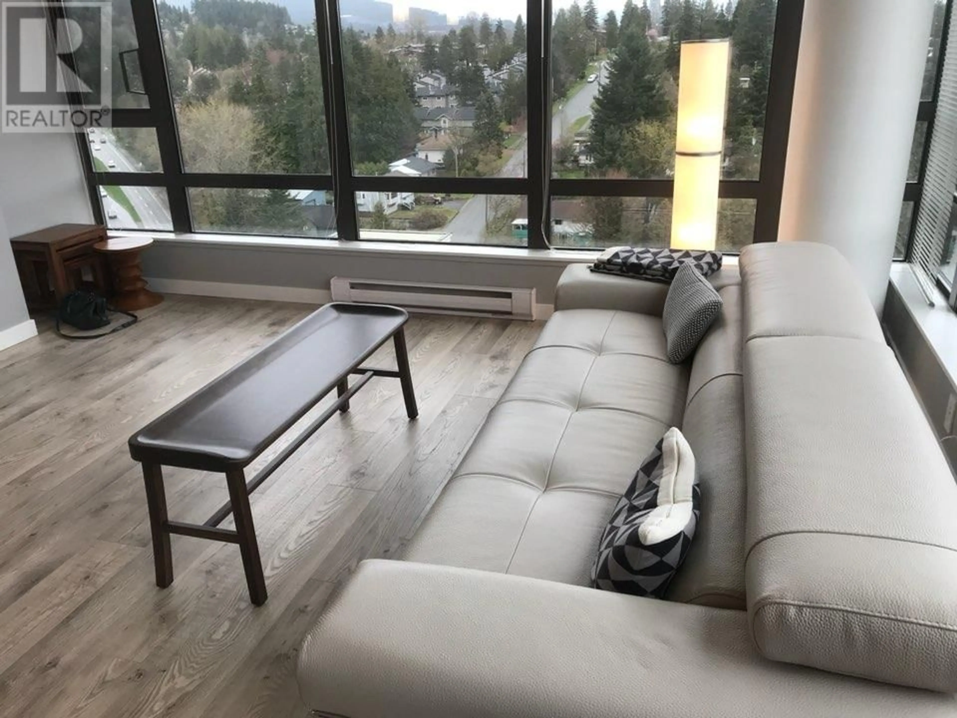 Living room with furniture, wood/laminate floor for 1502 - 110 BREW STREET, Port Moody British Columbia V3H0E4