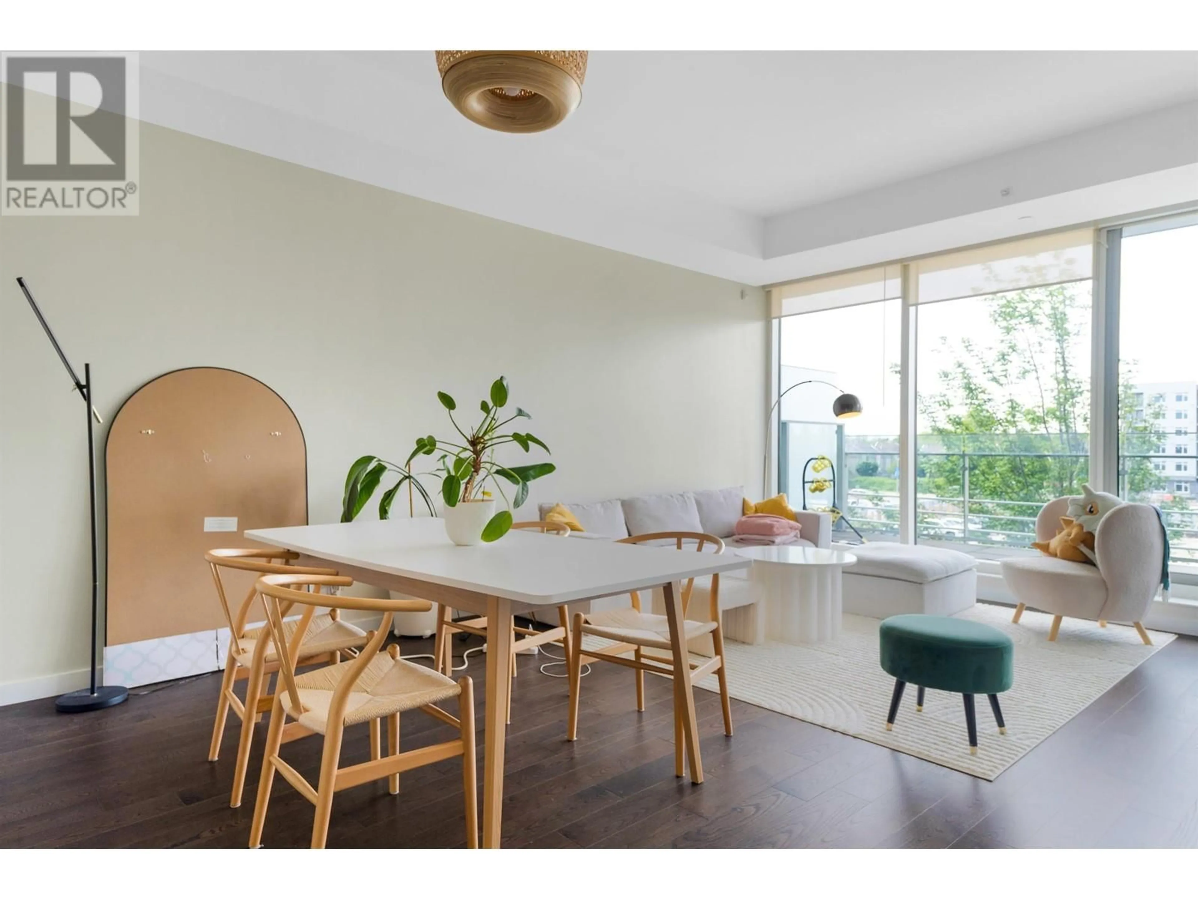 Dining room, wood/laminate floor for 310 - 5177 BRIGHOUSE WAY, Richmond British Columbia V7C0A7
