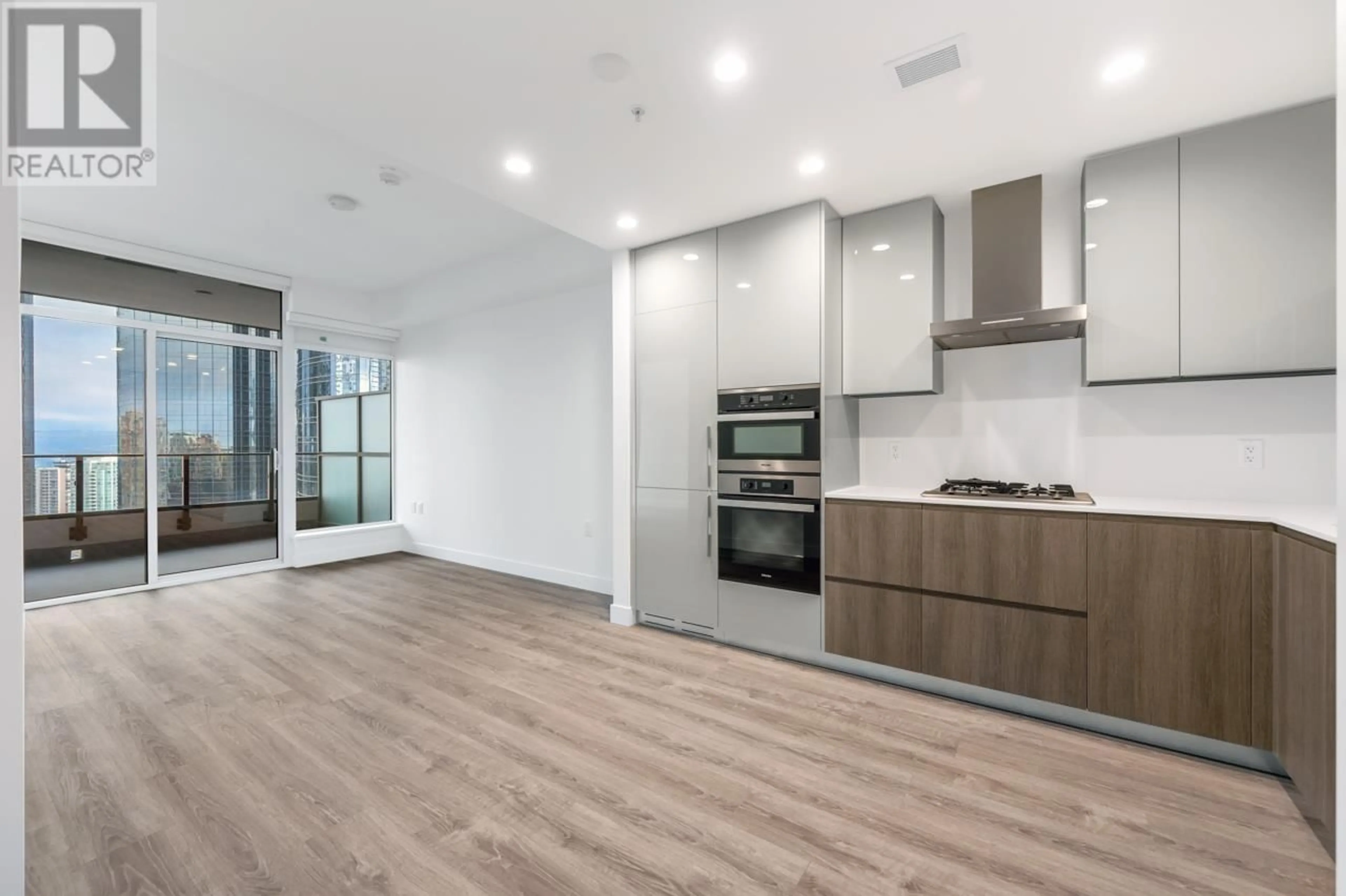 Open concept kitchen, wood/laminate floor for 1409 - 6511 SUSSEX AVENUE, Burnaby British Columbia V5H0K5