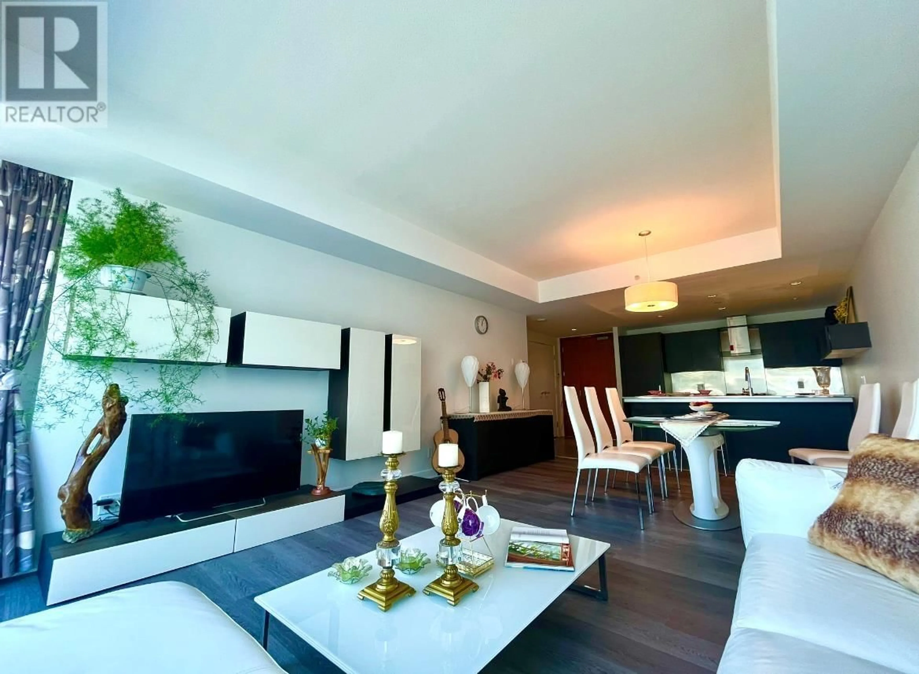 Living room with furniture, wood/laminate floor for 811 - 5199 BRIGHOUSE WAY, Richmond British Columbia V7C0A7