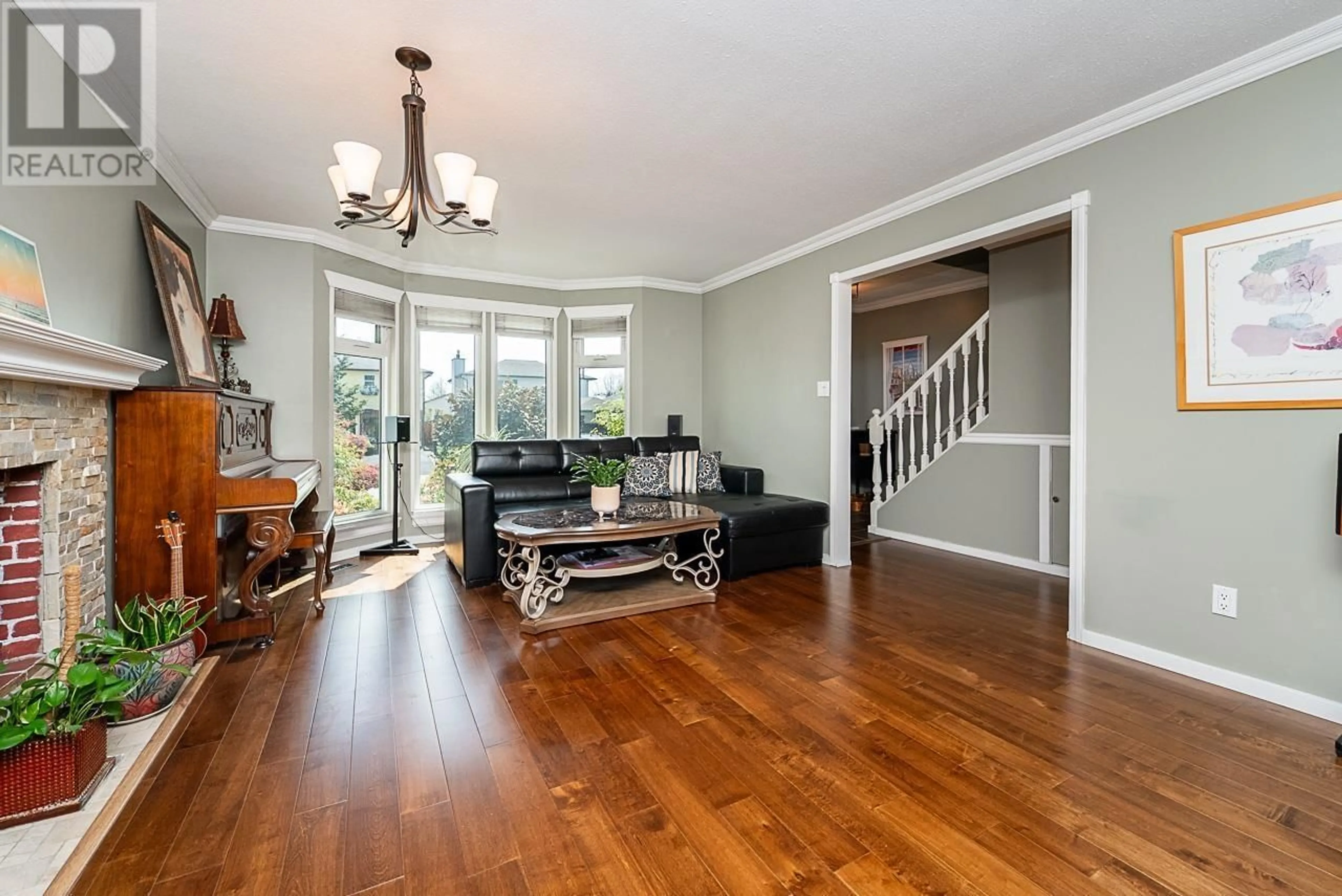 Living room with furniture, wood/laminate floor for 19519 115A AVENUE, Pitt Meadows British Columbia V3Y1R5