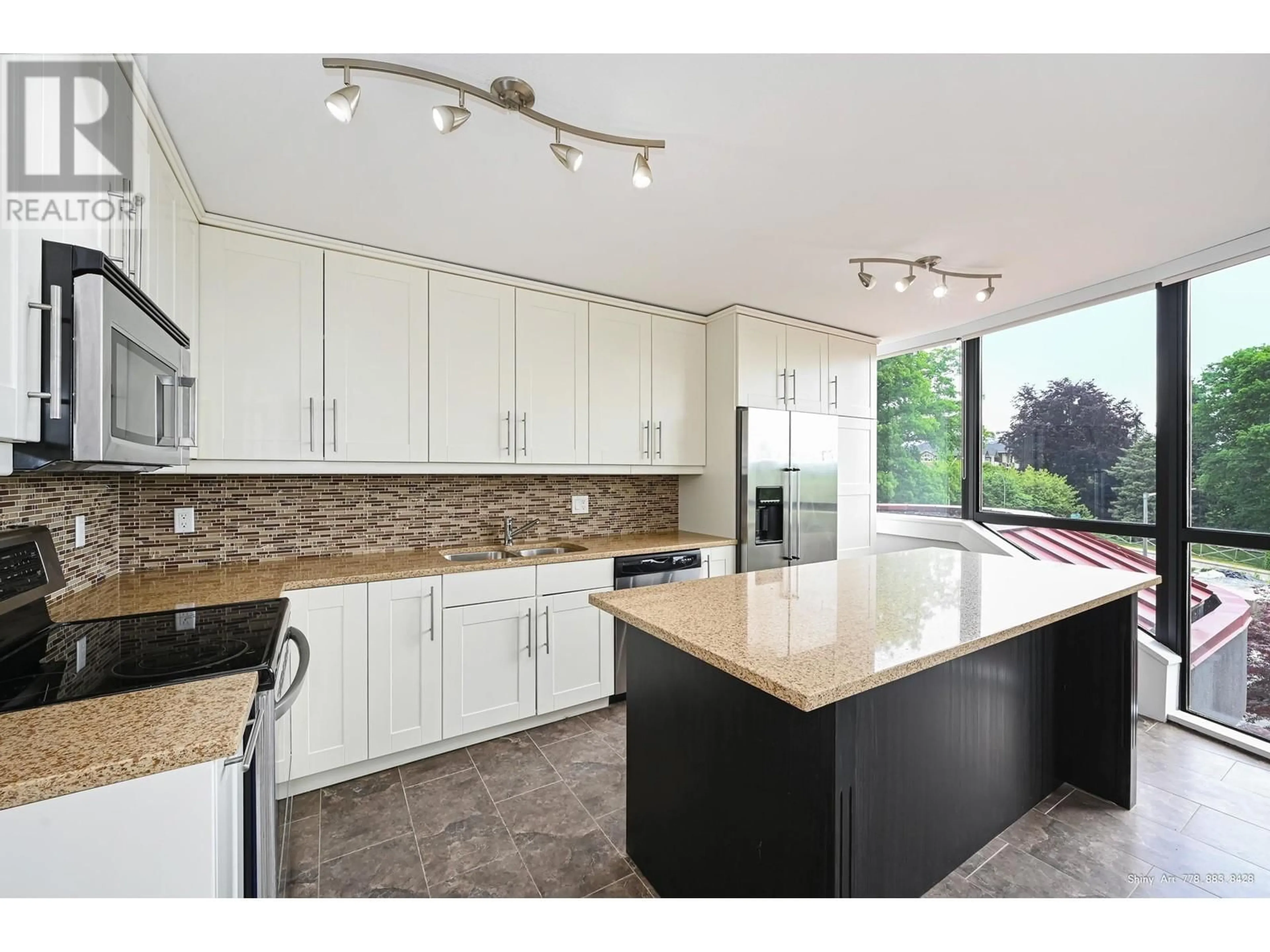Open concept kitchen, unknown for 102 - 38 LEOPOLD PLACE, New Westminster British Columbia V3L2C6
