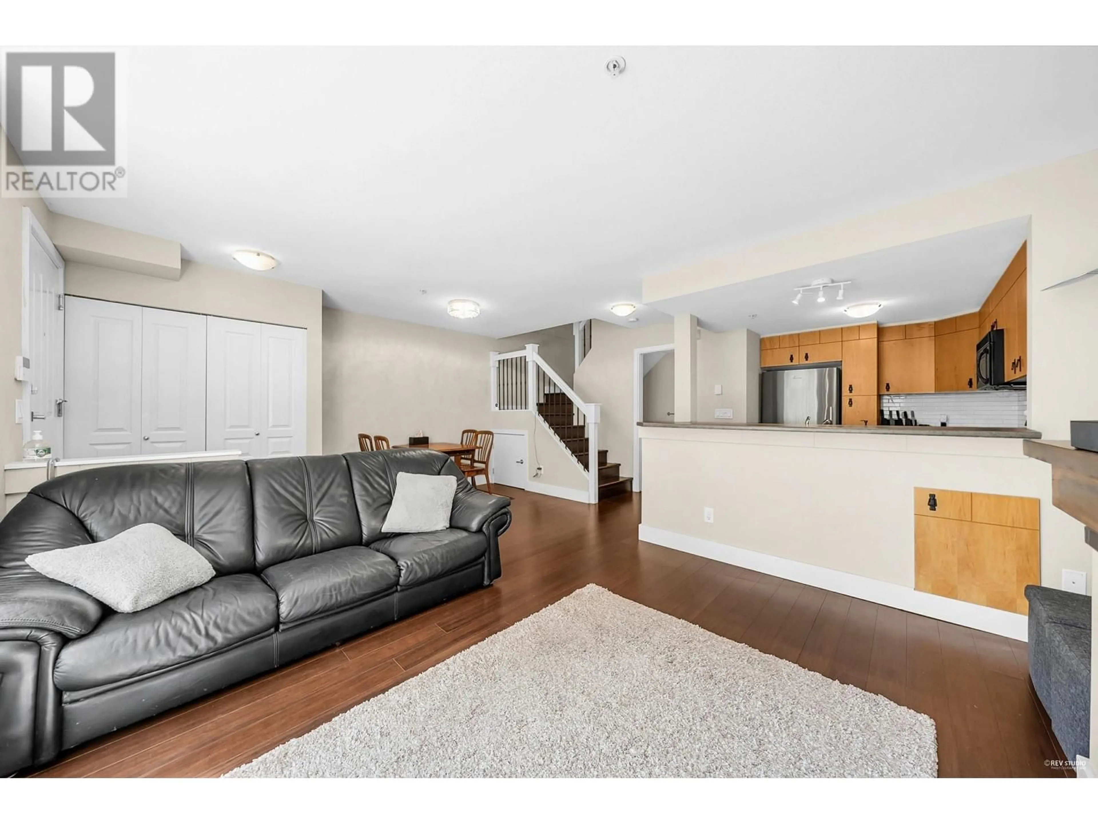 Living room with furniture, wood/laminate floor for 28 - 7428 SOUTHWYNDE AVENUE, Burnaby British Columbia V3N0A1