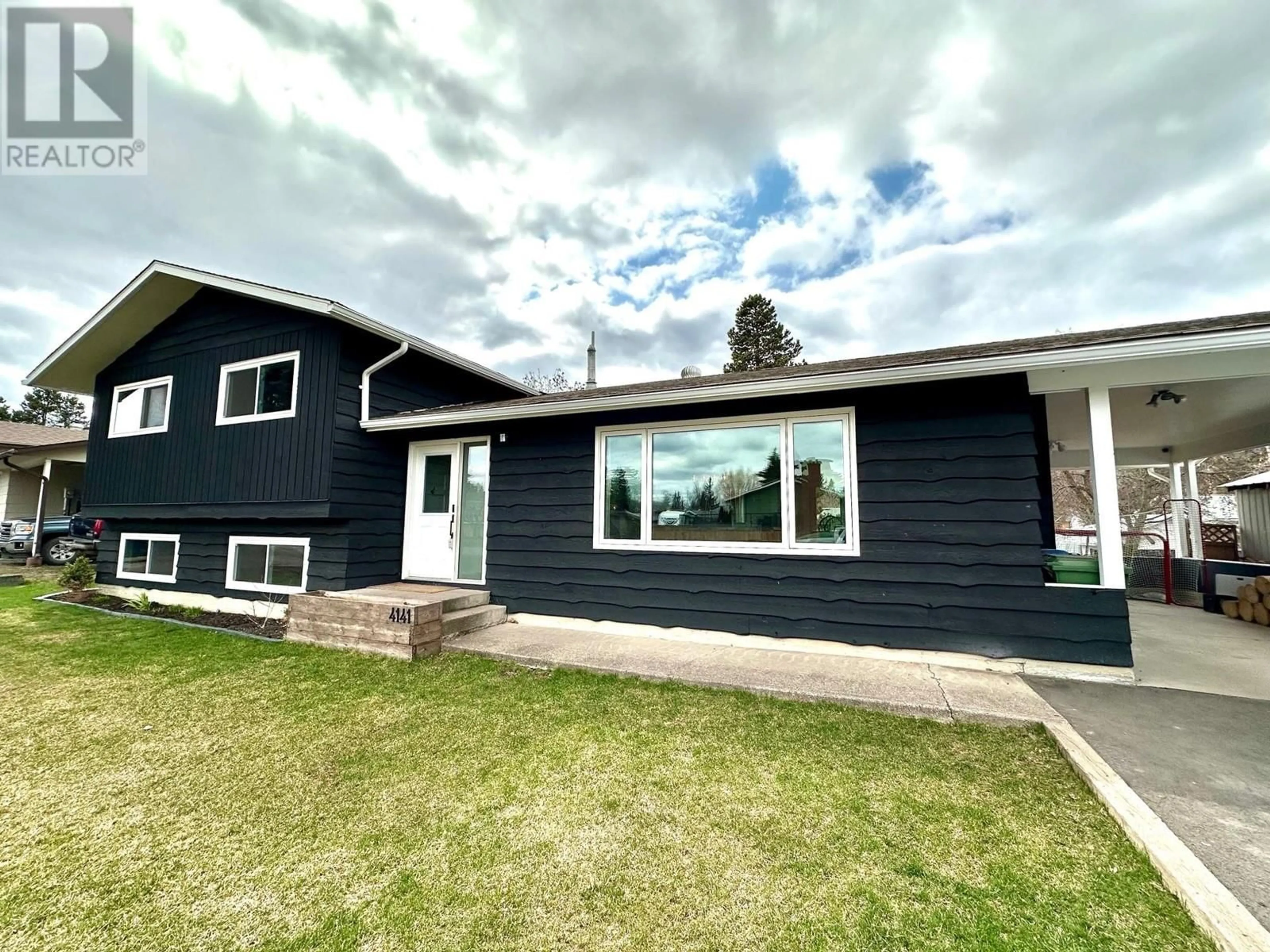 Home with vinyl exterior material, street for 4141 7TH AVENUE, Smithers British Columbia V0J2N0
