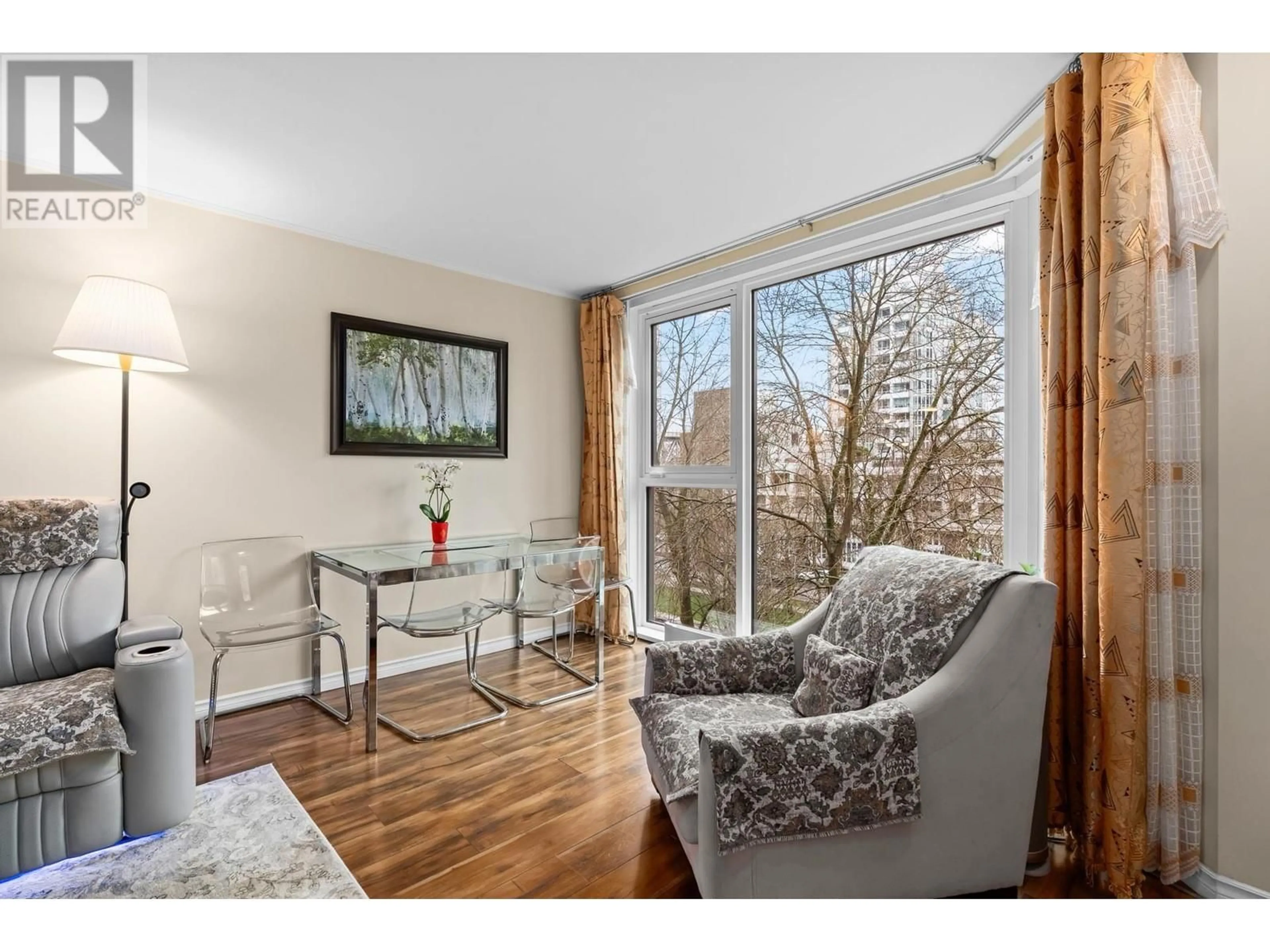 Living room with furniture, wood/laminate floor for 303 - 1488 HORNBY STREET, Vancouver British Columbia V6Z1X3