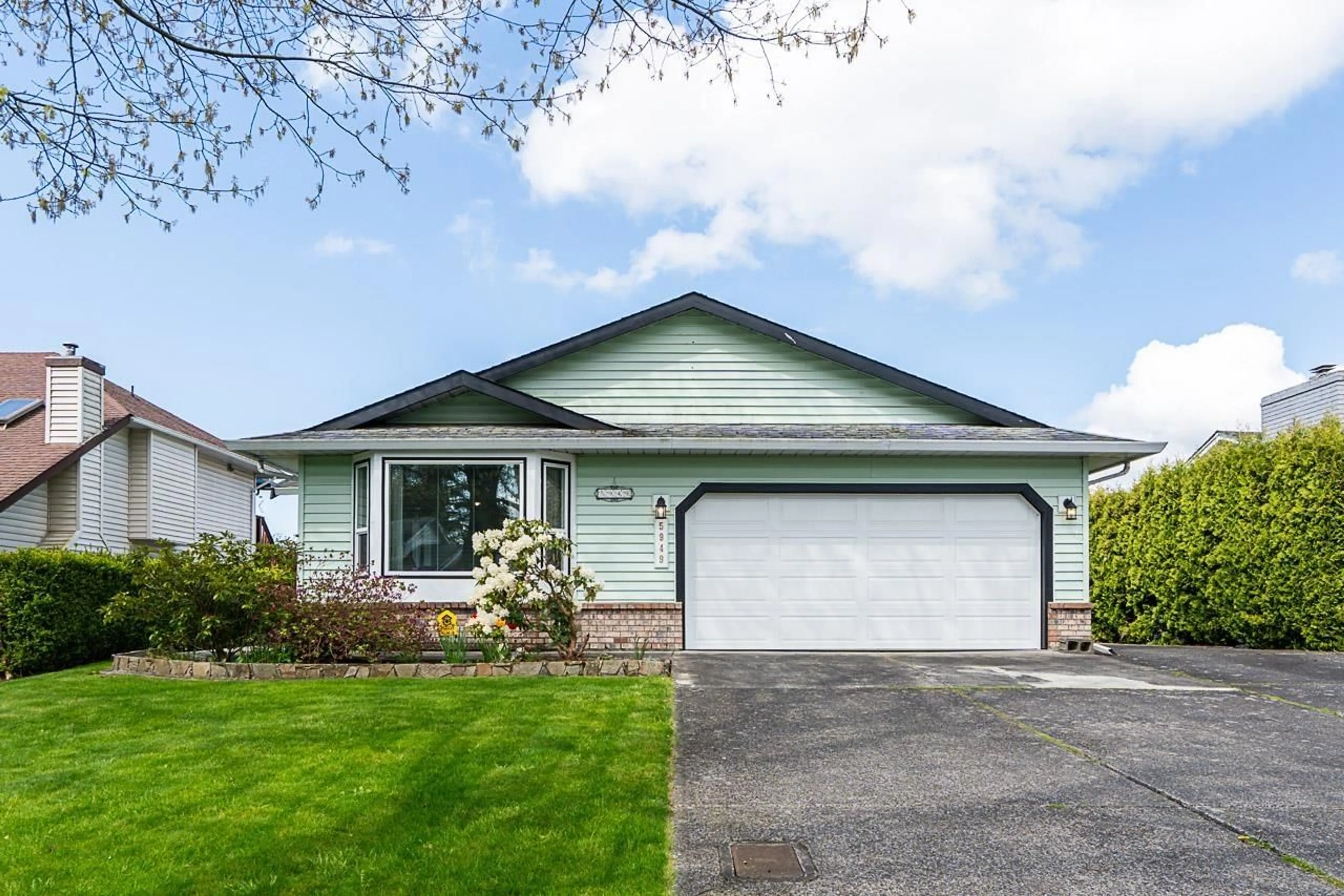 Home with vinyl exterior material, street for 5949 169, Surrey British Columbia V3S6Y5