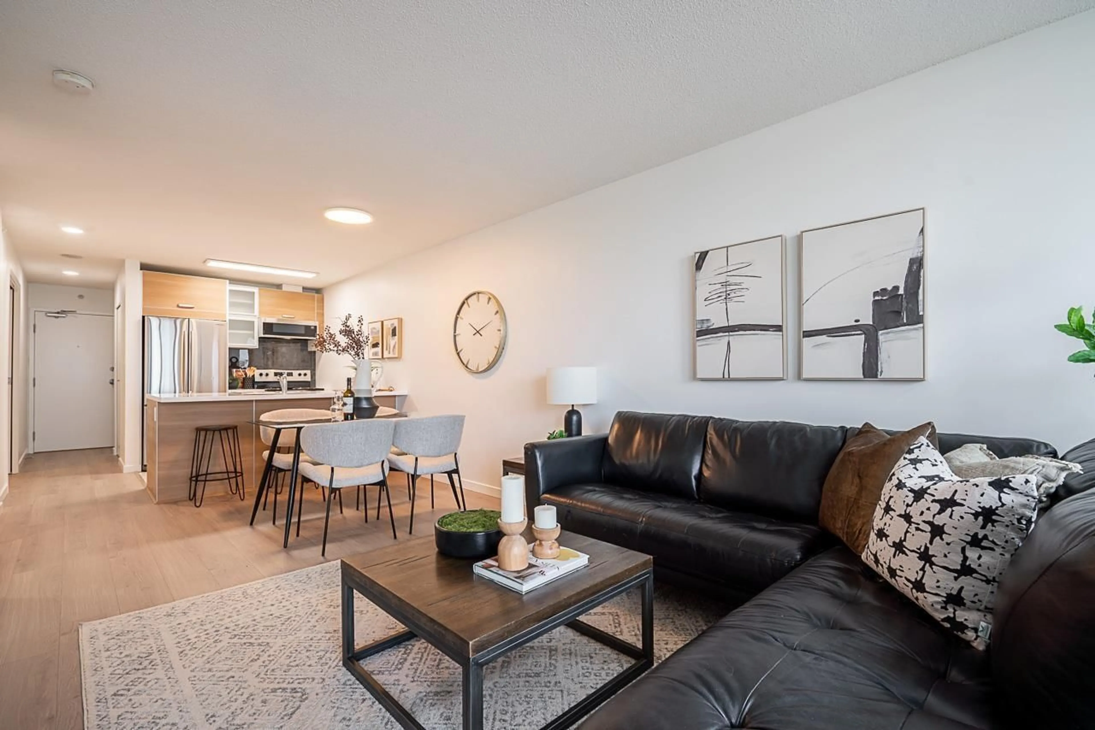 Living room with furniture, wood/laminate floor for 203 - 13688 100, Surrey British Columbia V3T0G5