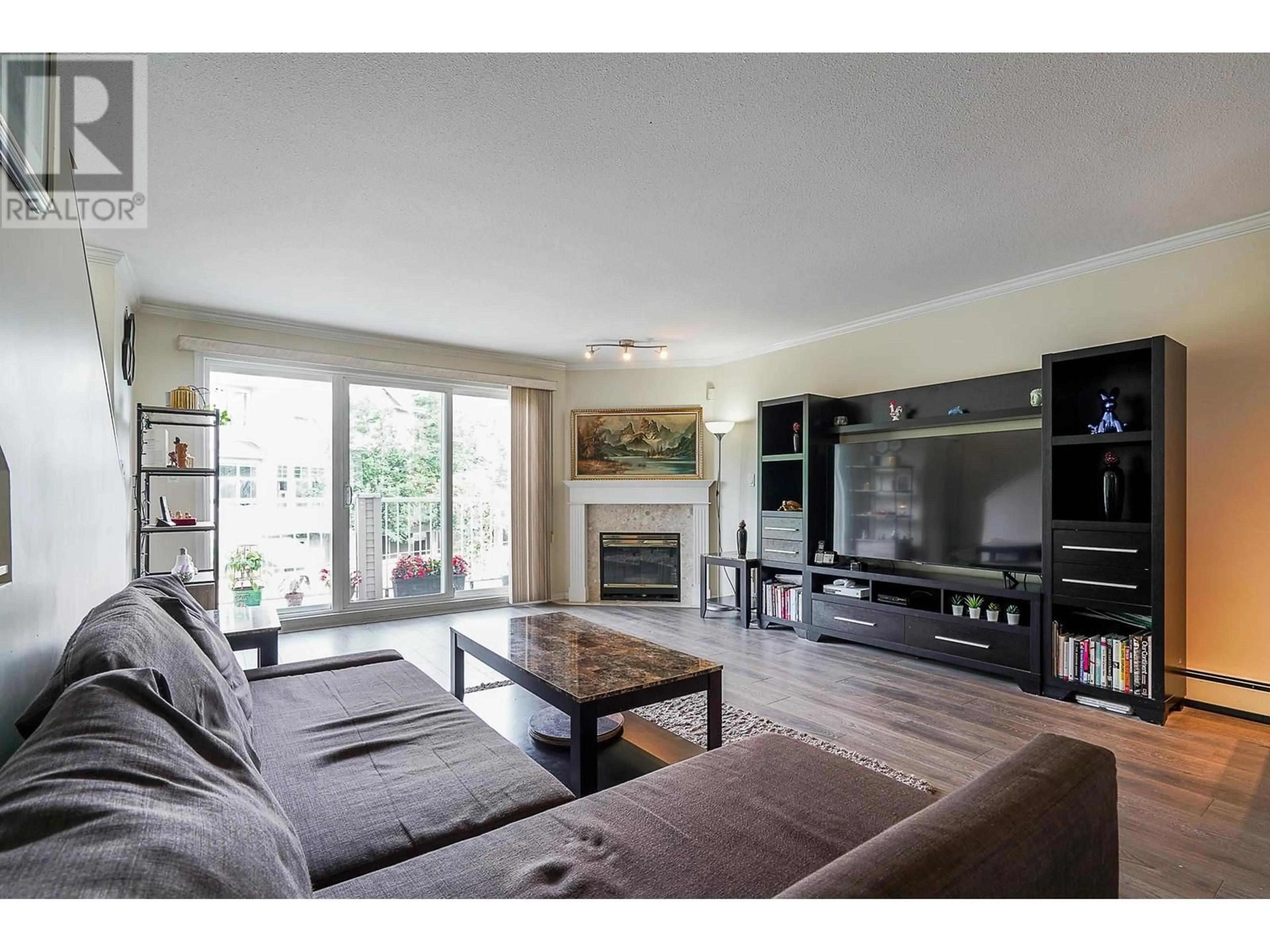 Living room with furniture, wood/laminate floor for 44 - 22800 WINDSOR COURT, Richmond British Columbia V6V2X6