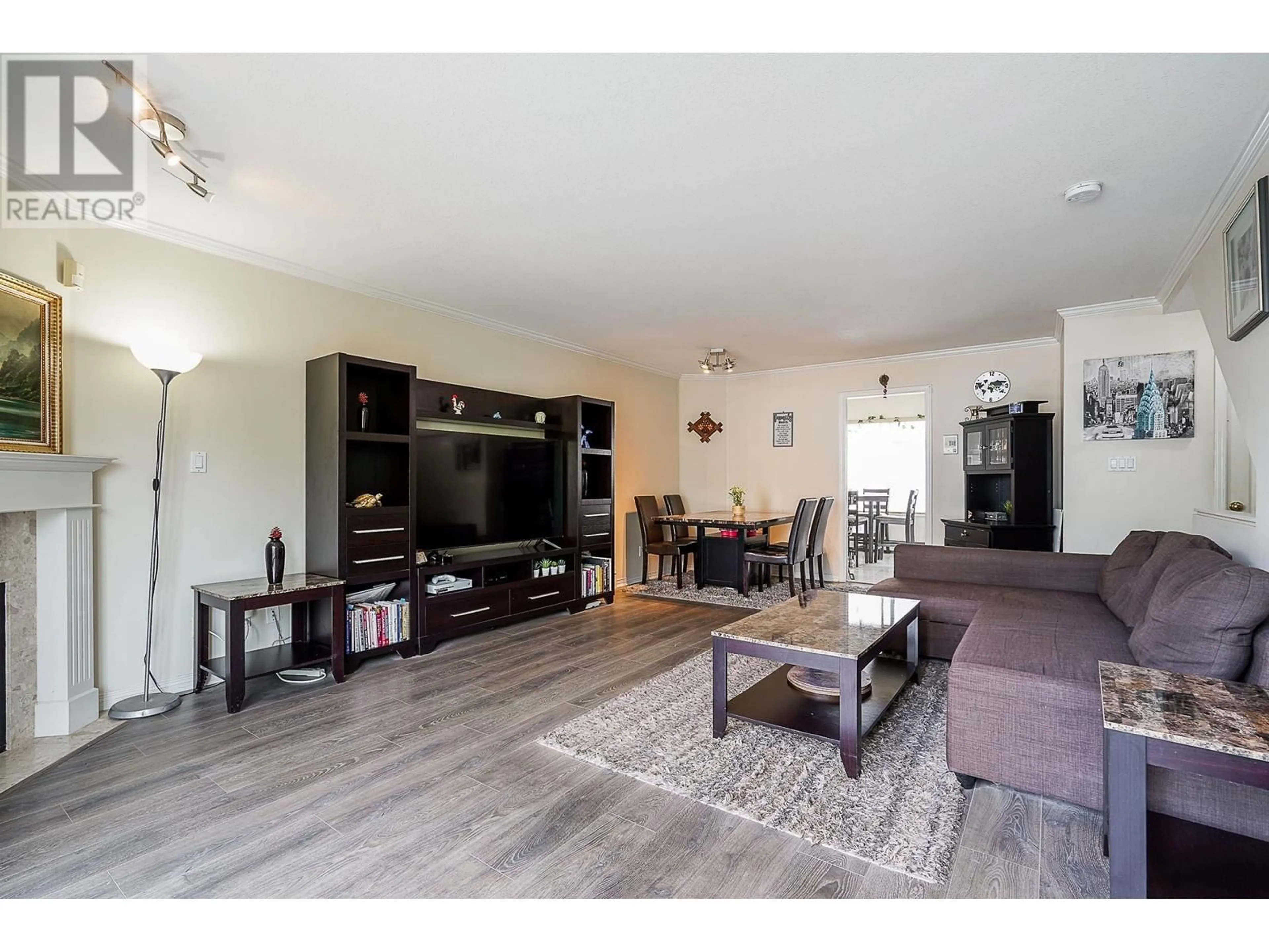 Living room with furniture, wood/laminate floor for 44 - 22800 WINDSOR COURT, Richmond British Columbia V6V2X6