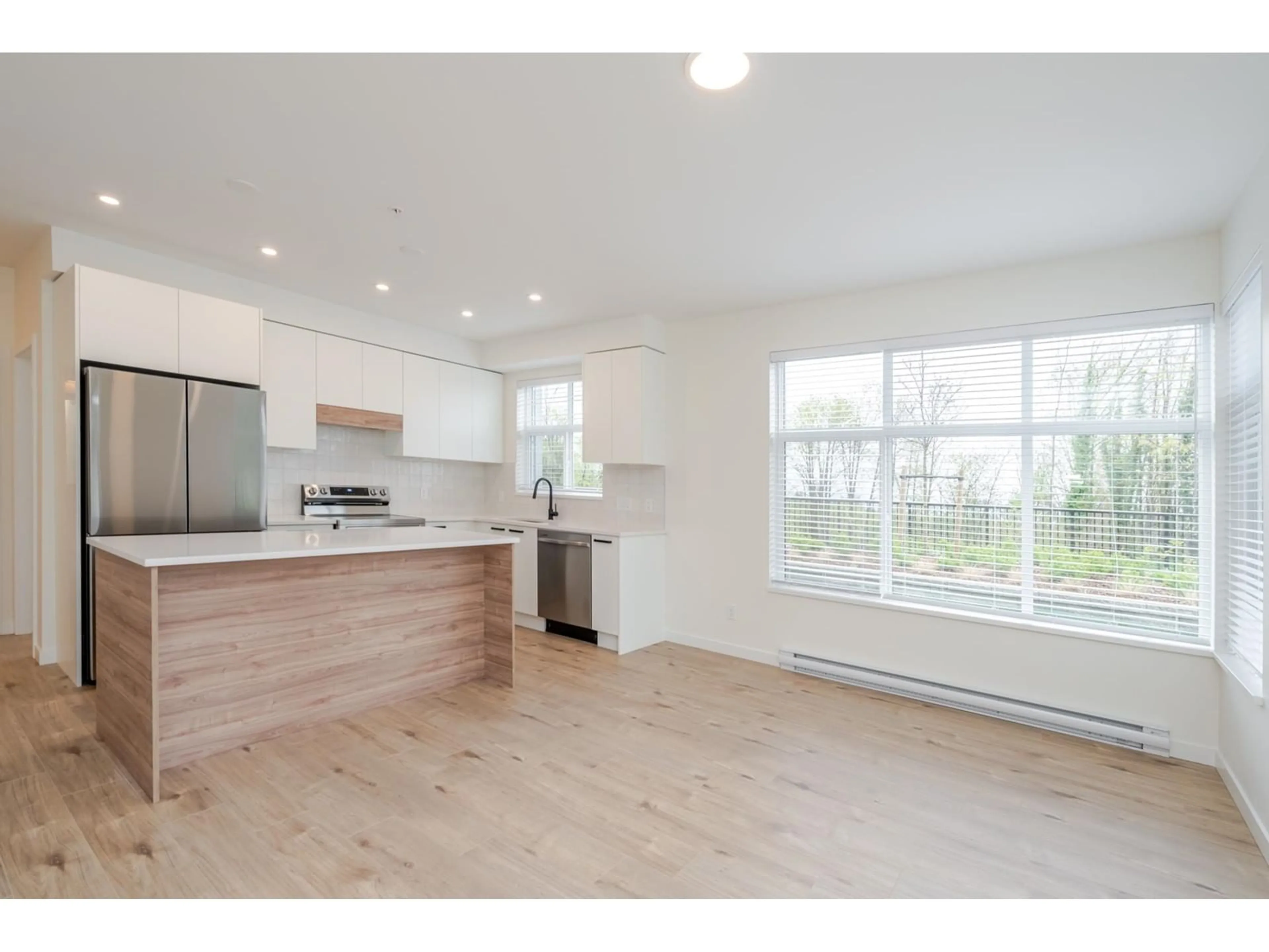 Open concept kitchen, wood/laminate floor for 106 - 33920 BEST, Mission British Columbia V2V7A4