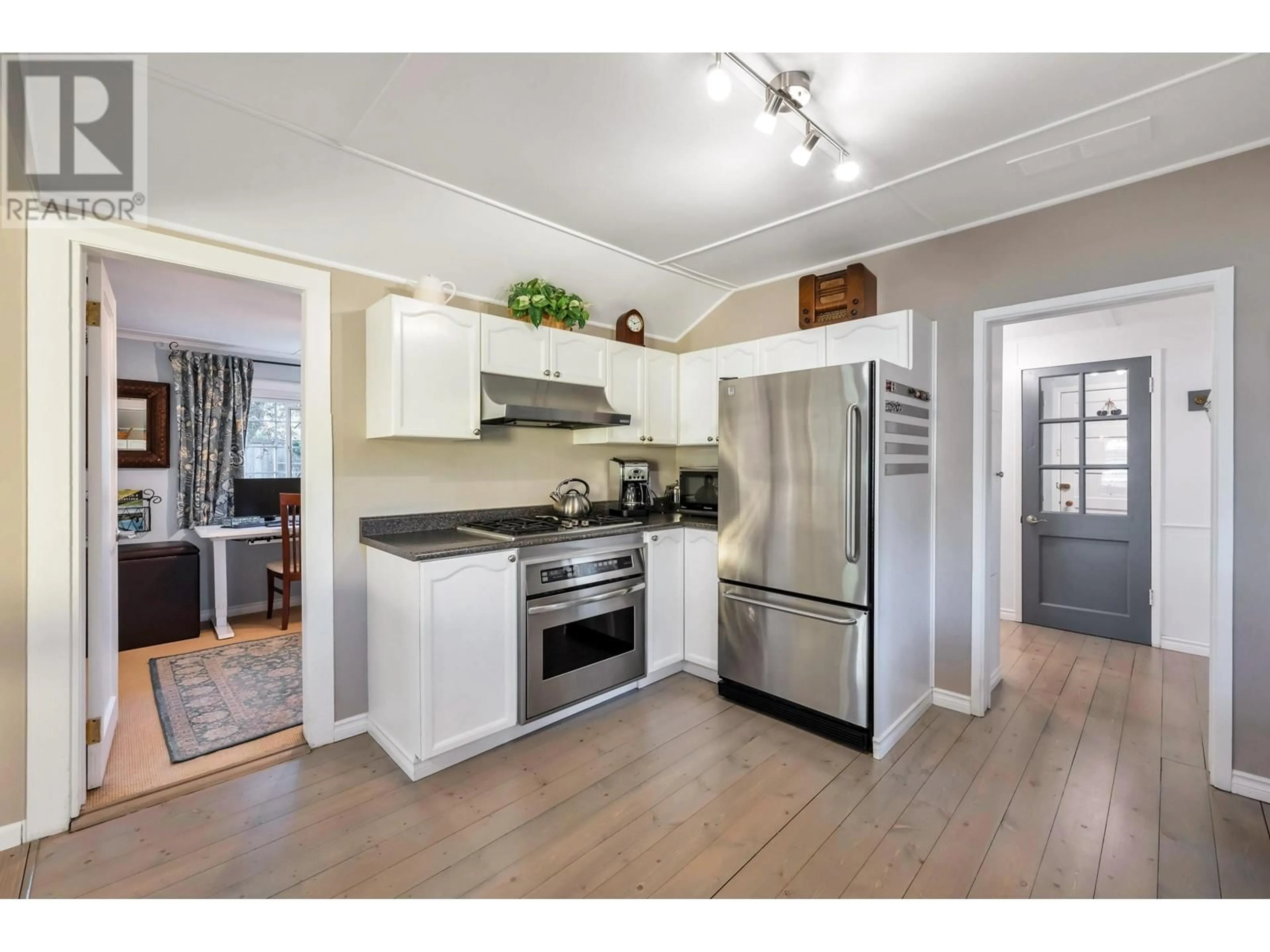 Open concept kitchen, wood/laminate floor for 165 66A STREET, Delta British Columbia V4L1M6