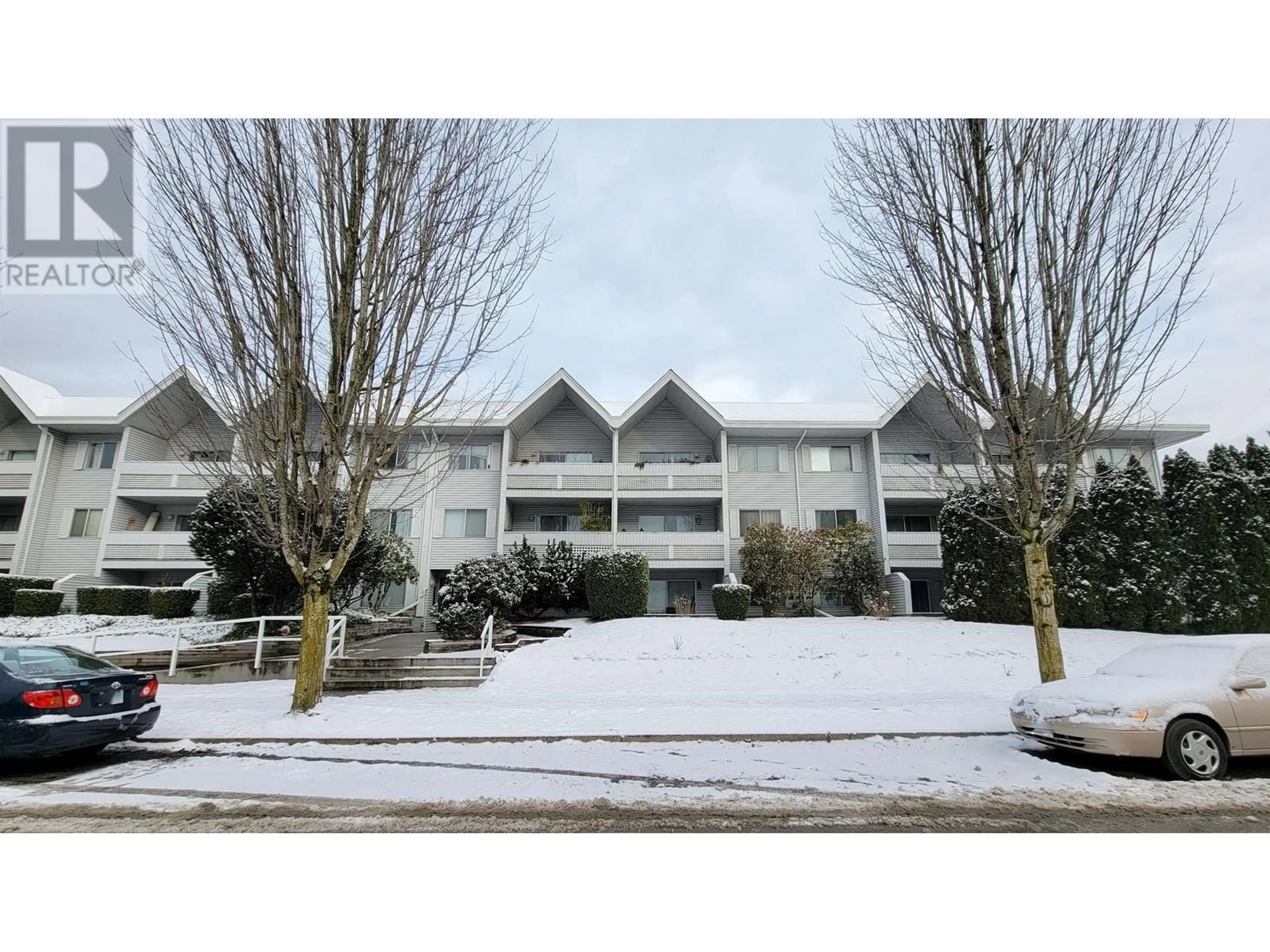 A pic from outside/outdoor area/front of a property/back of a property/a pic from drone, mountain view for 106 - 2055 SUFFOLK AVENUE, Port Coquitlam British Columbia V3B1H4