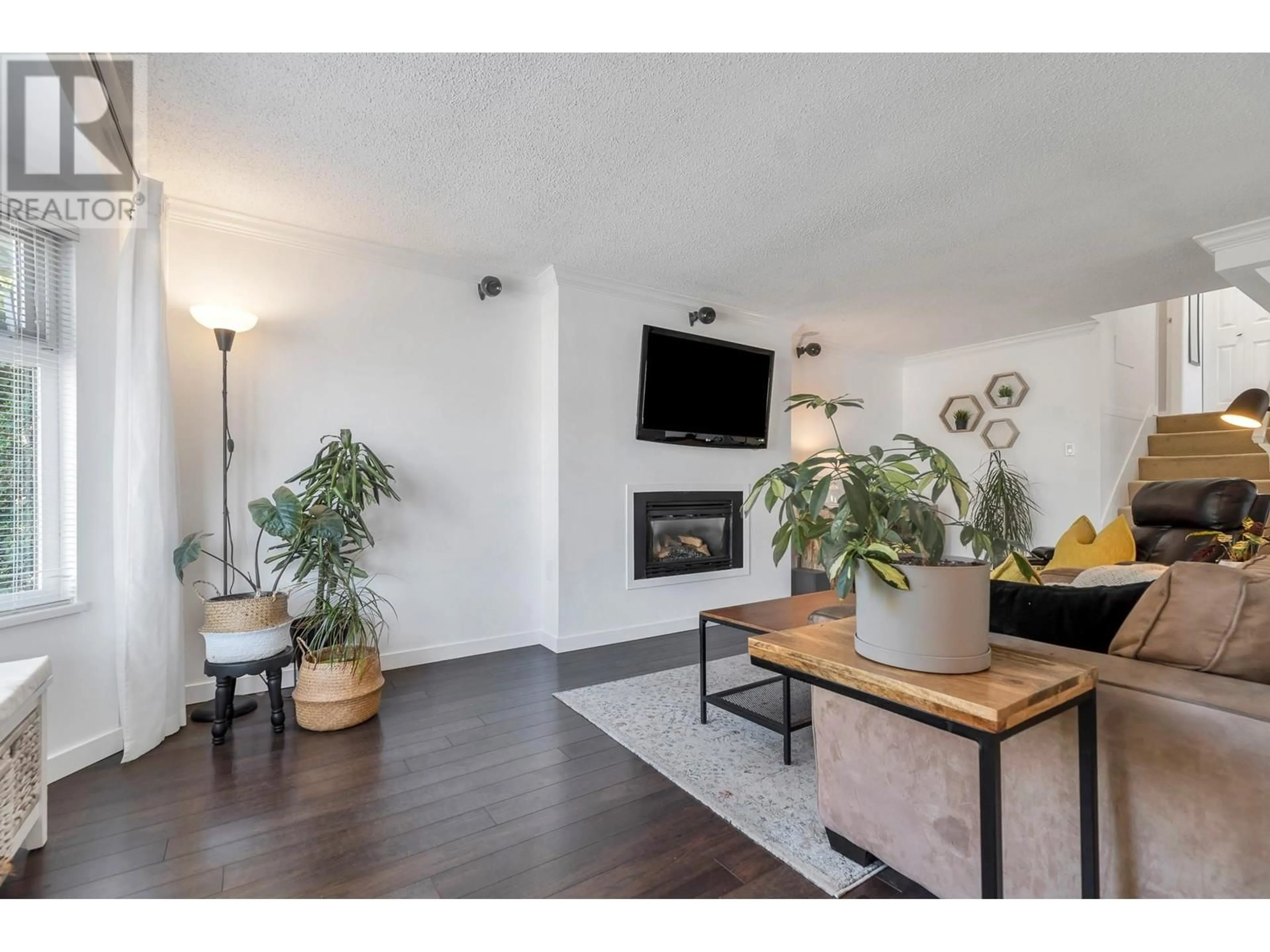 Living room with furniture, wood/laminate floor for 3822 HUNT STREET, Richmond British Columbia V7E2M3