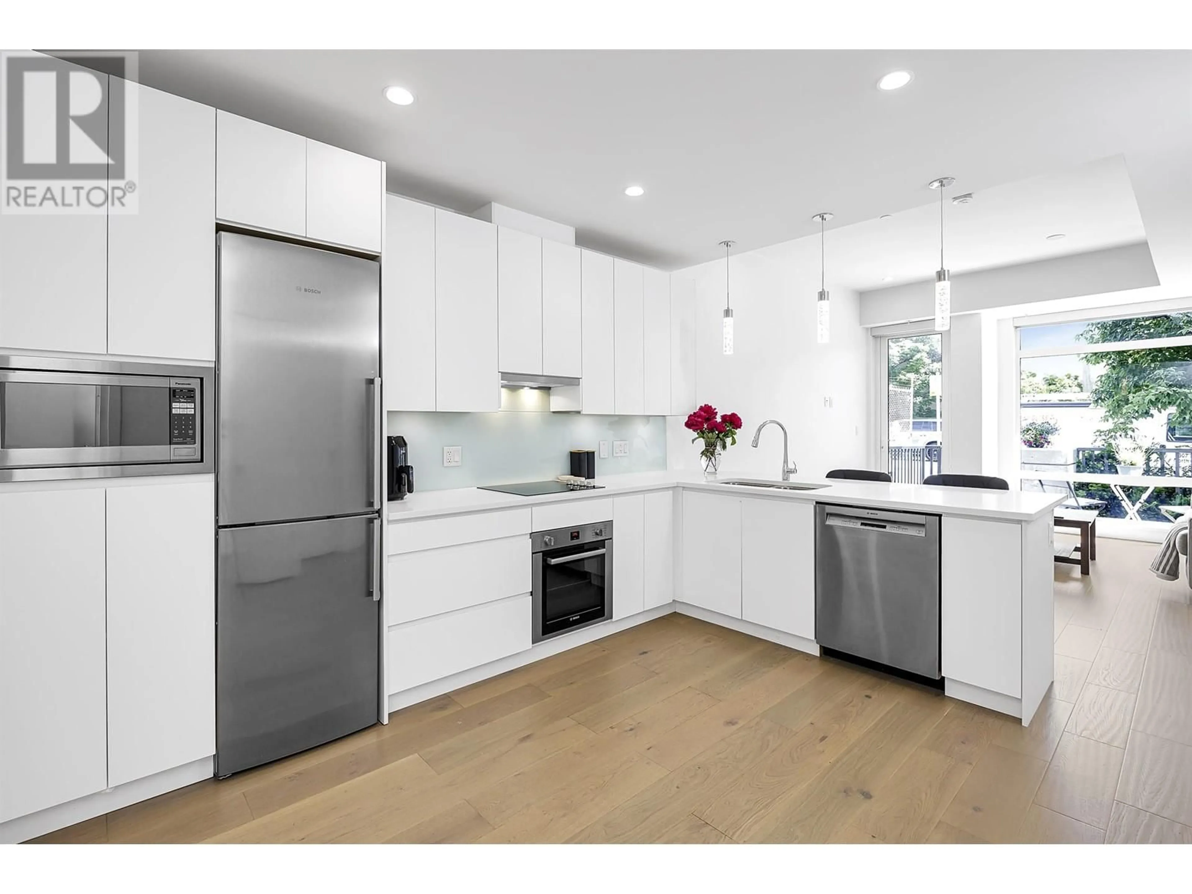 Open concept kitchen, unknown for 105 - 1591 BOWSER AVENUE, North Vancouver British Columbia V7P2Y4